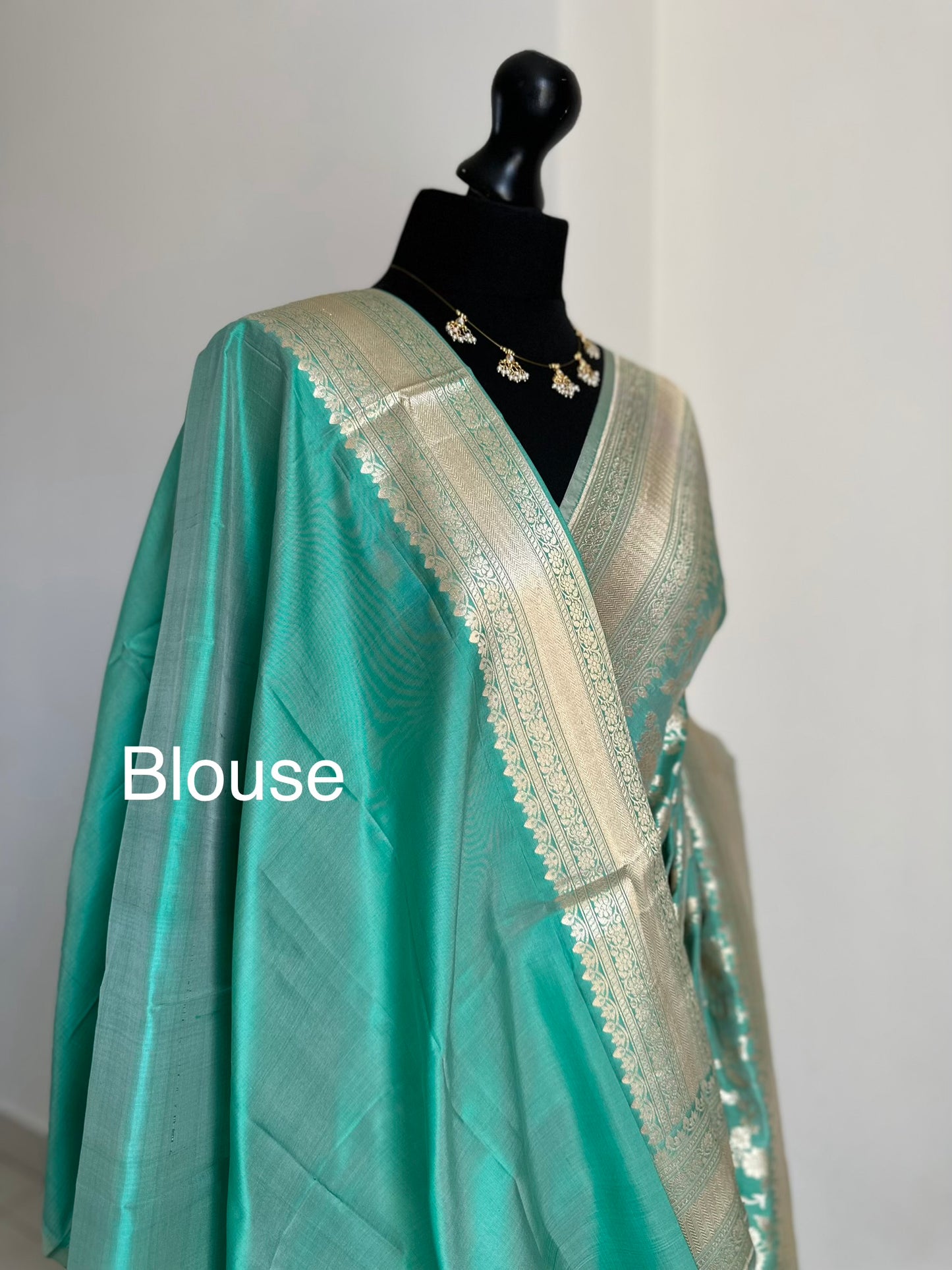 Elegant seafoam green Pure Silk Banarasi Saree with Intricate Gold Zari Work