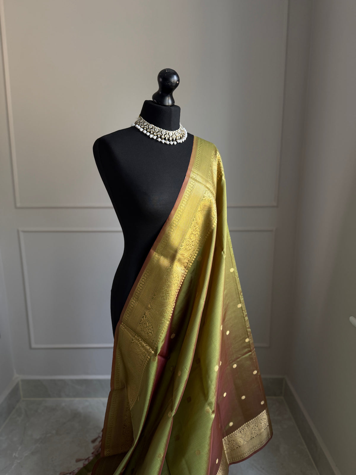 Olive green and maroon hues dual tone silk saree with gold zari border