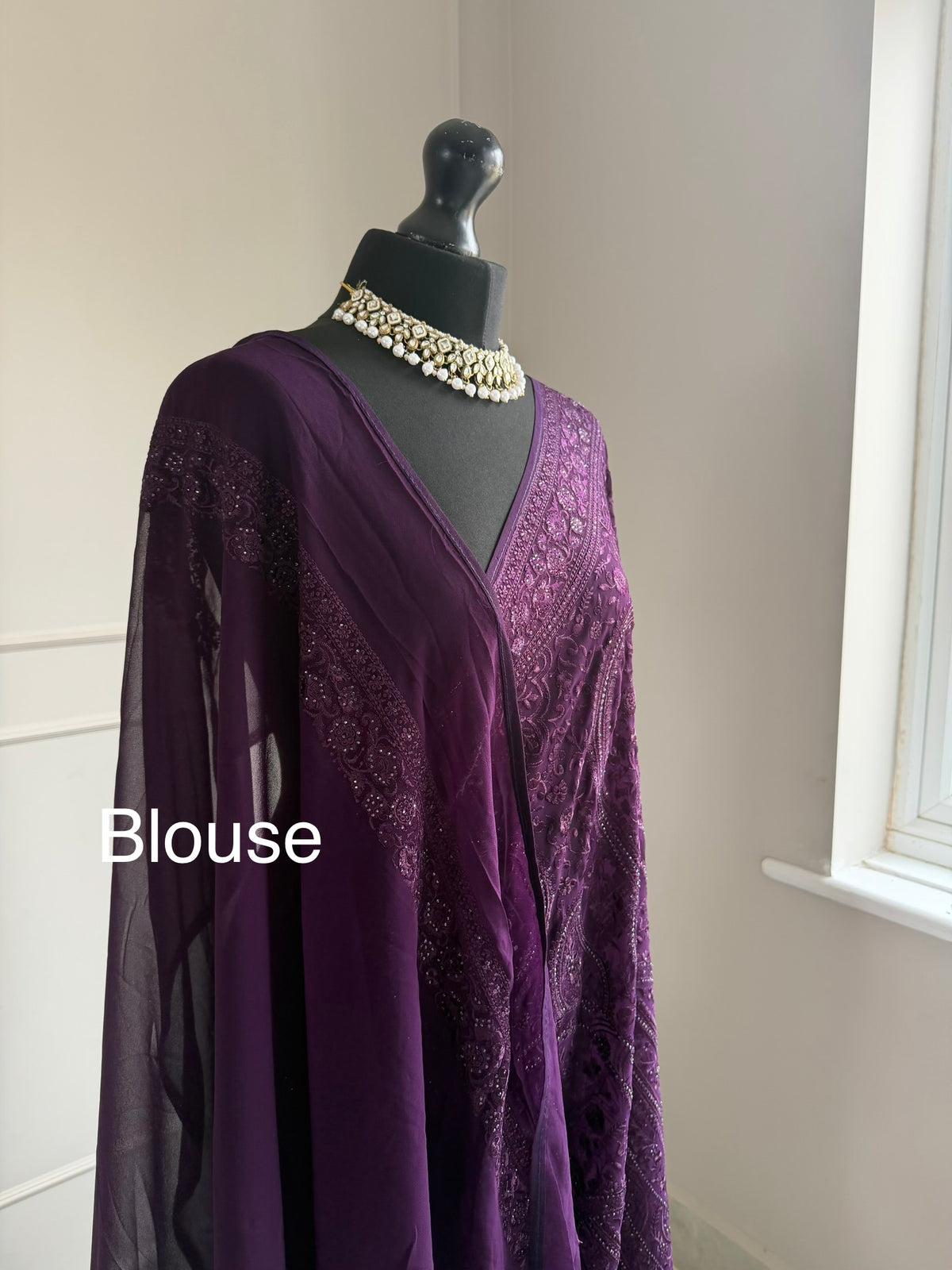 Purple fully embroidered saree with stone work detailing