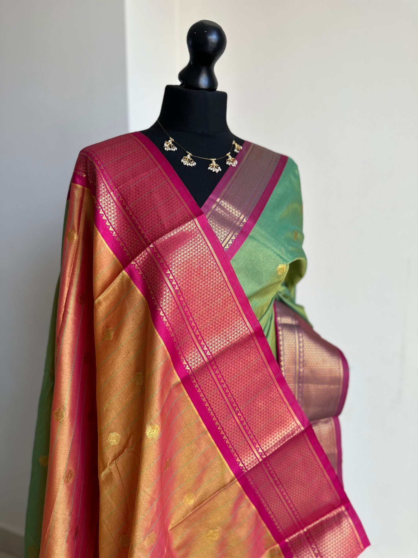 Green and pink colour saree with gold zari border and buti. Traditional semi silk saree beautiful colour and design. Designer saree