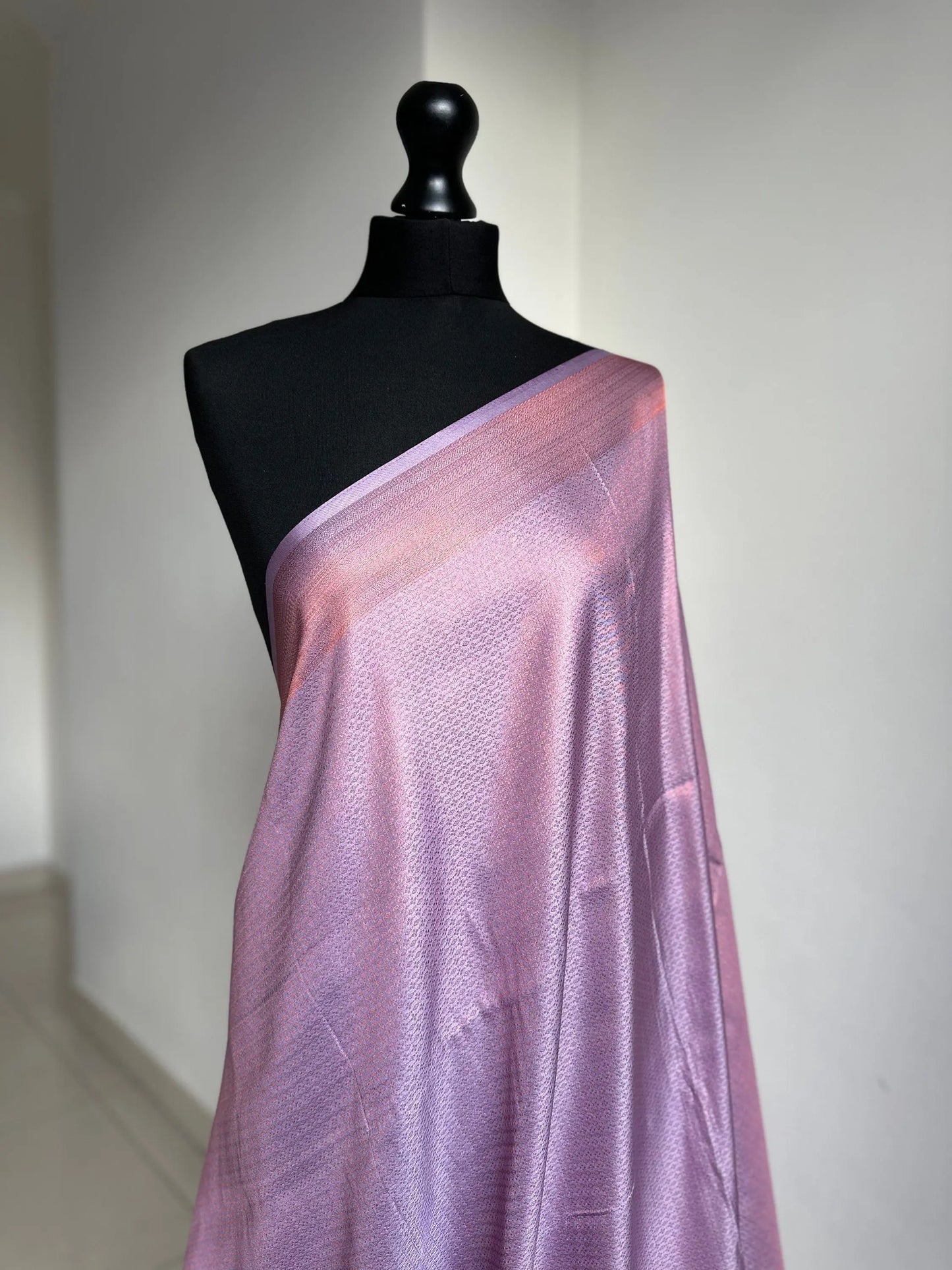 Lilac soft silk saree with a copper border and all over sheen. The perfect saree for parties and all traditional events. Versatile saree - LaiLai Sarees