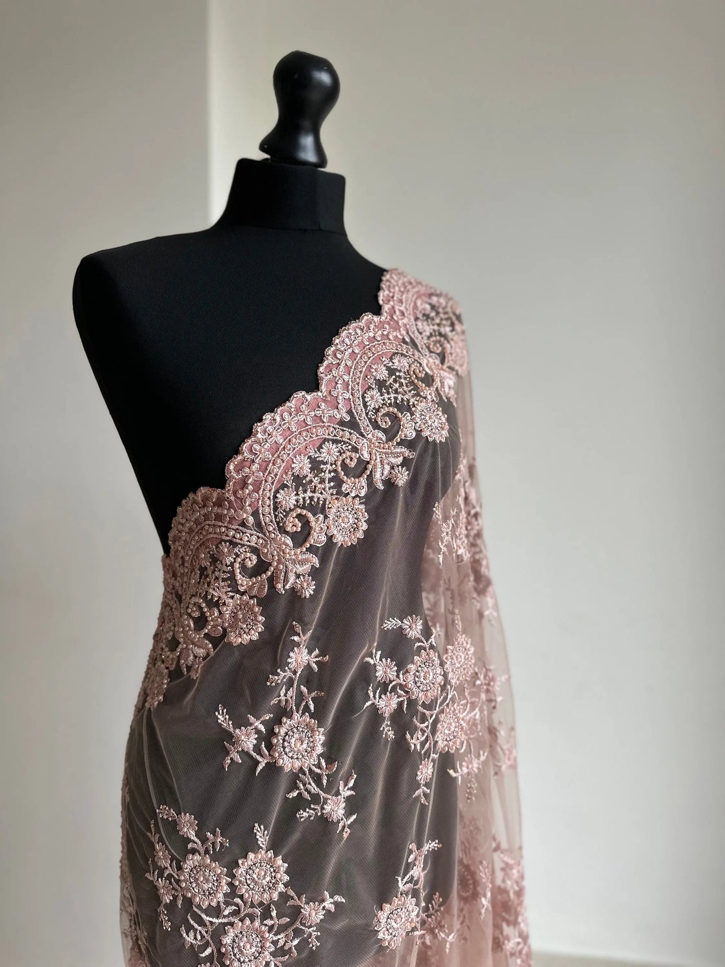 Nude pink lace saree for parties. Intricate lace designer saree with matching petticoat and blouse unstitched. Wedding or party saree - LaiLai Sarees
