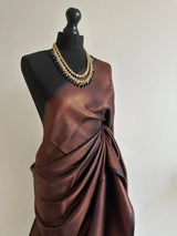 Black soft silk saree with a copper border and all over sheen. The perfect saree for parties and all traditional events. - LaiLai Sarees