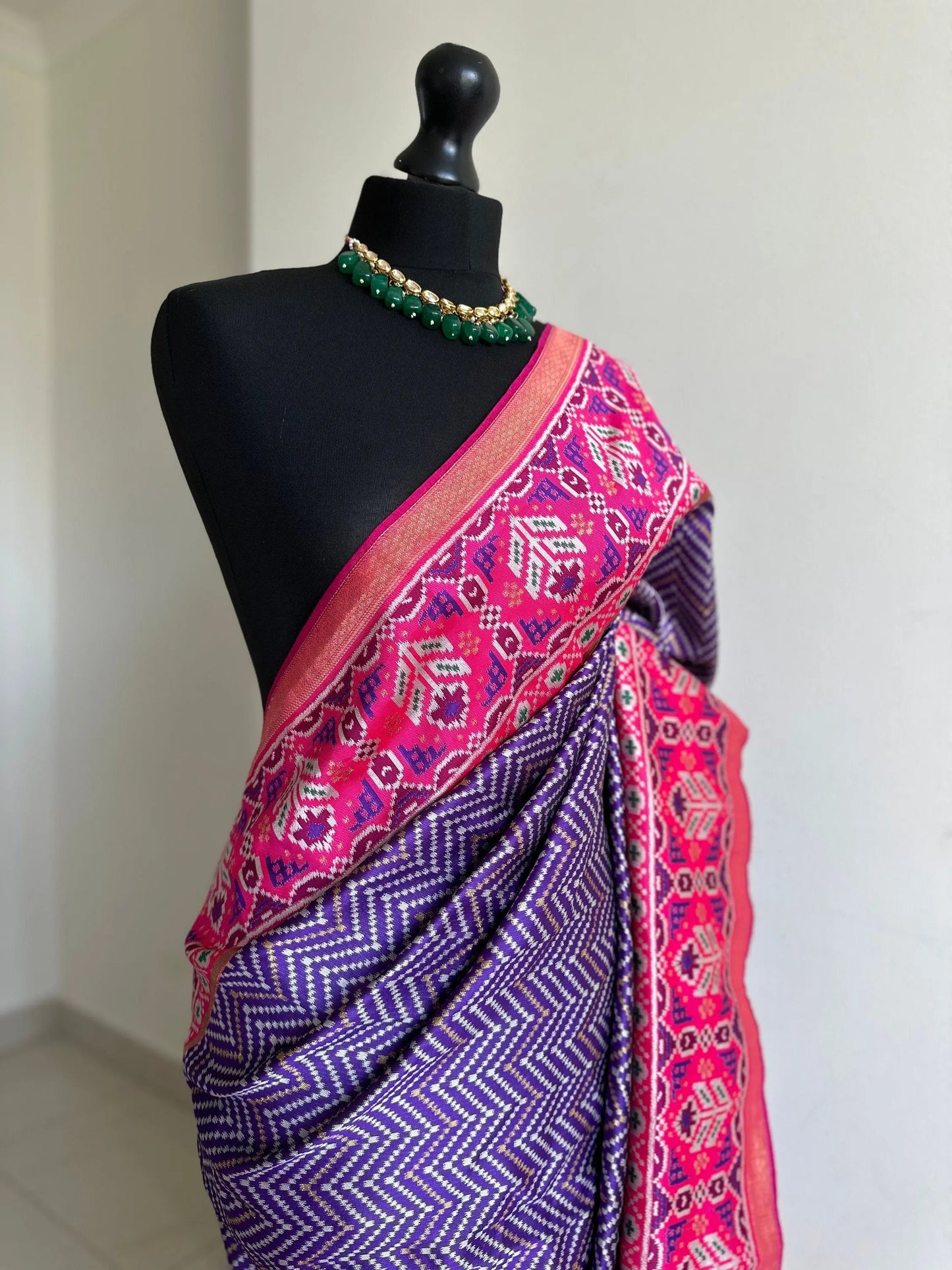 Purple and pink silk patola saree with printed and weaved zari work. Designer saree with blouse for weddings. Designer saree blouse - LaiLai Sarees