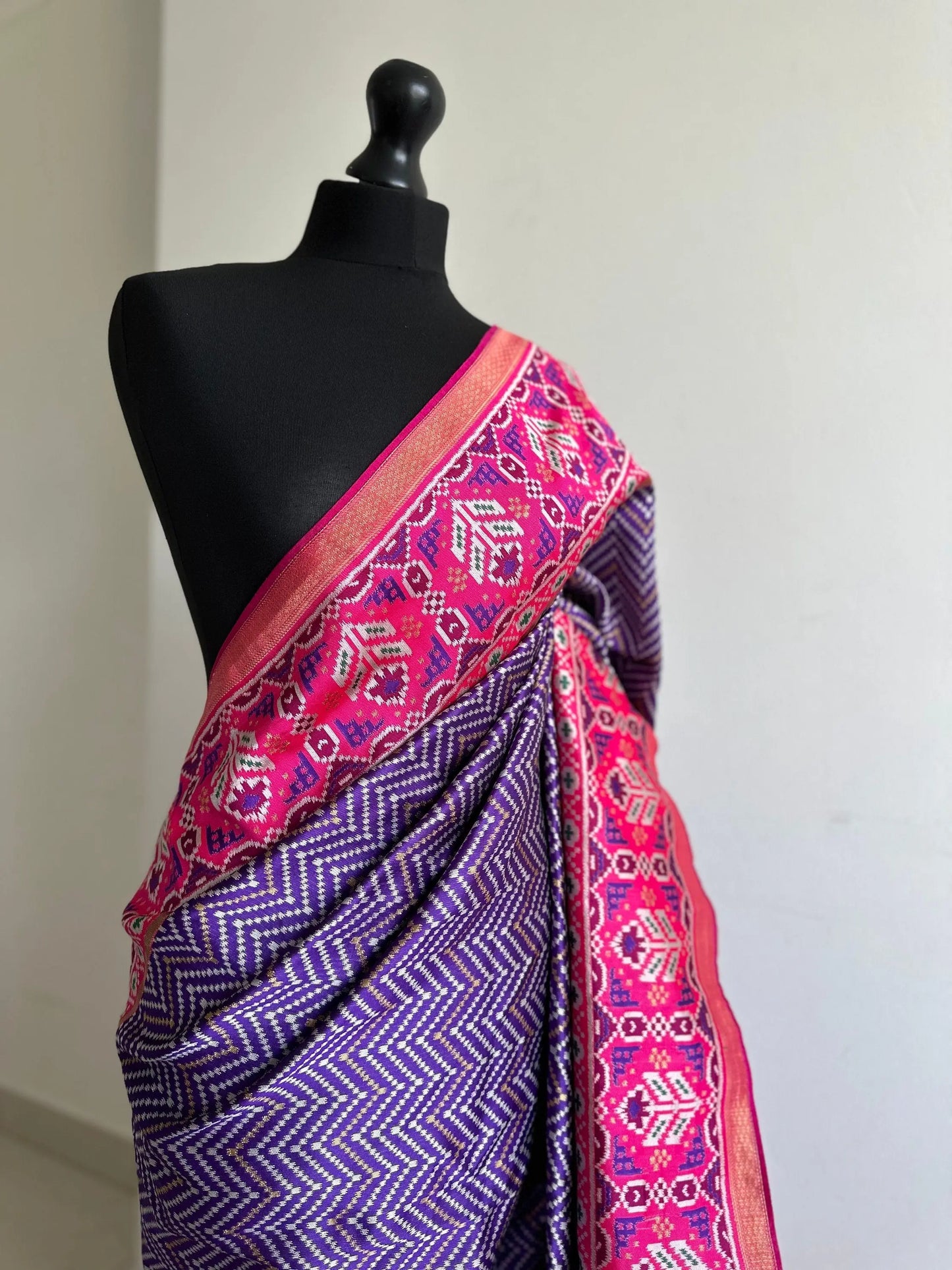 Purple and pink silk patola saree with printed and weaved zari work. Designer saree with blouse for weddings. Designer saree blouse - LaiLai Sarees