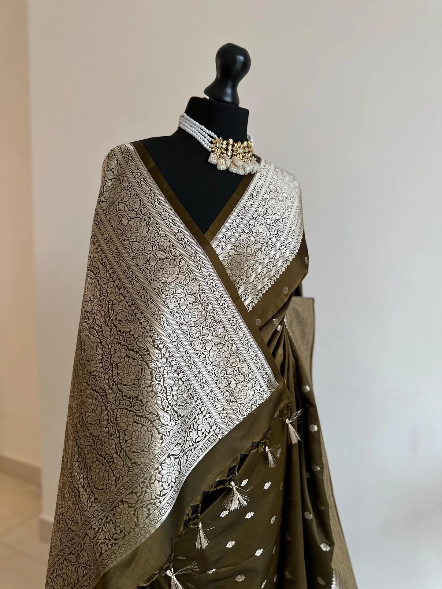 Banarasi silk saree in hues of khaki olive green dark brown with gold Zari.Gold green Saree with plain contrast blouse border for sleeves - LaiLai Sarees