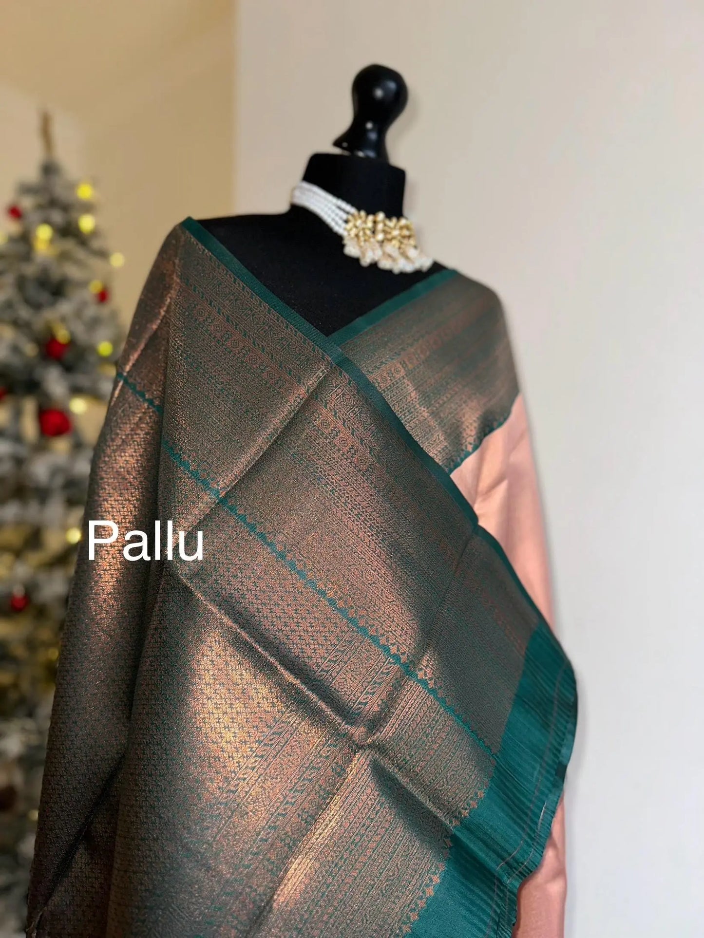 Semi silk peach pink saree with green border and copper motifs. Modern and traditional silk saree beautiful colour and design.Designer saree - LaiLai Sarees