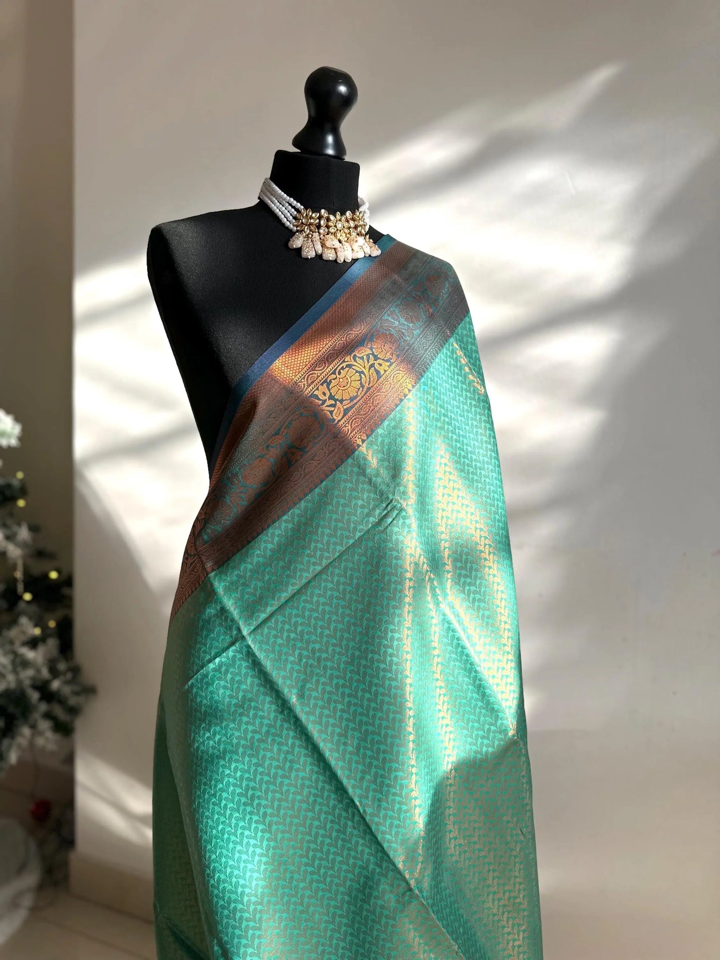 Authentic green saree with navy blue border copper zari and sheen. Traditional silk saree beautiful colour and design. Designer saree - LaiLai Sarees