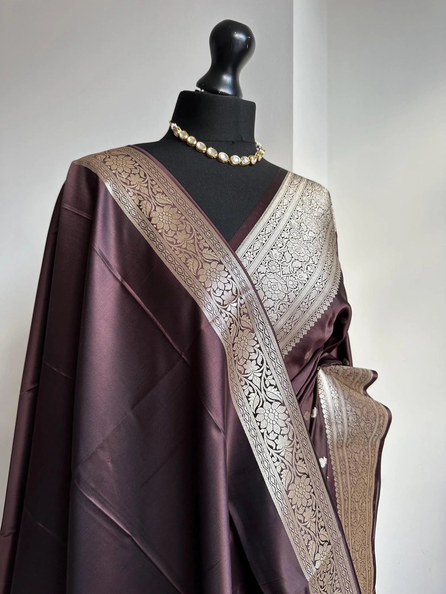 Banarasi silk in dark chocolate brown with gold zari. Gold and brown traditional wedding saree with plain contrast blouse with cuff border - LaiLai Sarees