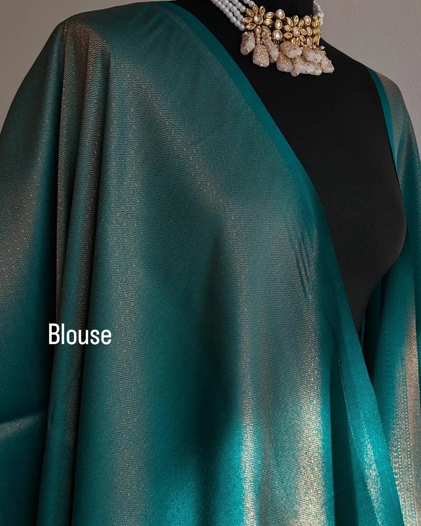 Sea green soft silk saree with a copper border and all over sheen. The perfect saree for parties and all traditional events. - LaiLai Sarees
