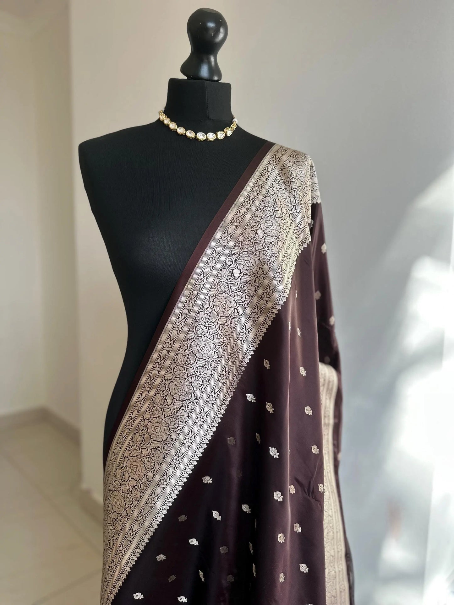 Banarasi silk in dark chocolate brown with gold zari. Gold and brown traditional wedding saree with plain contrast blouse with cuff border - LaiLai Sarees