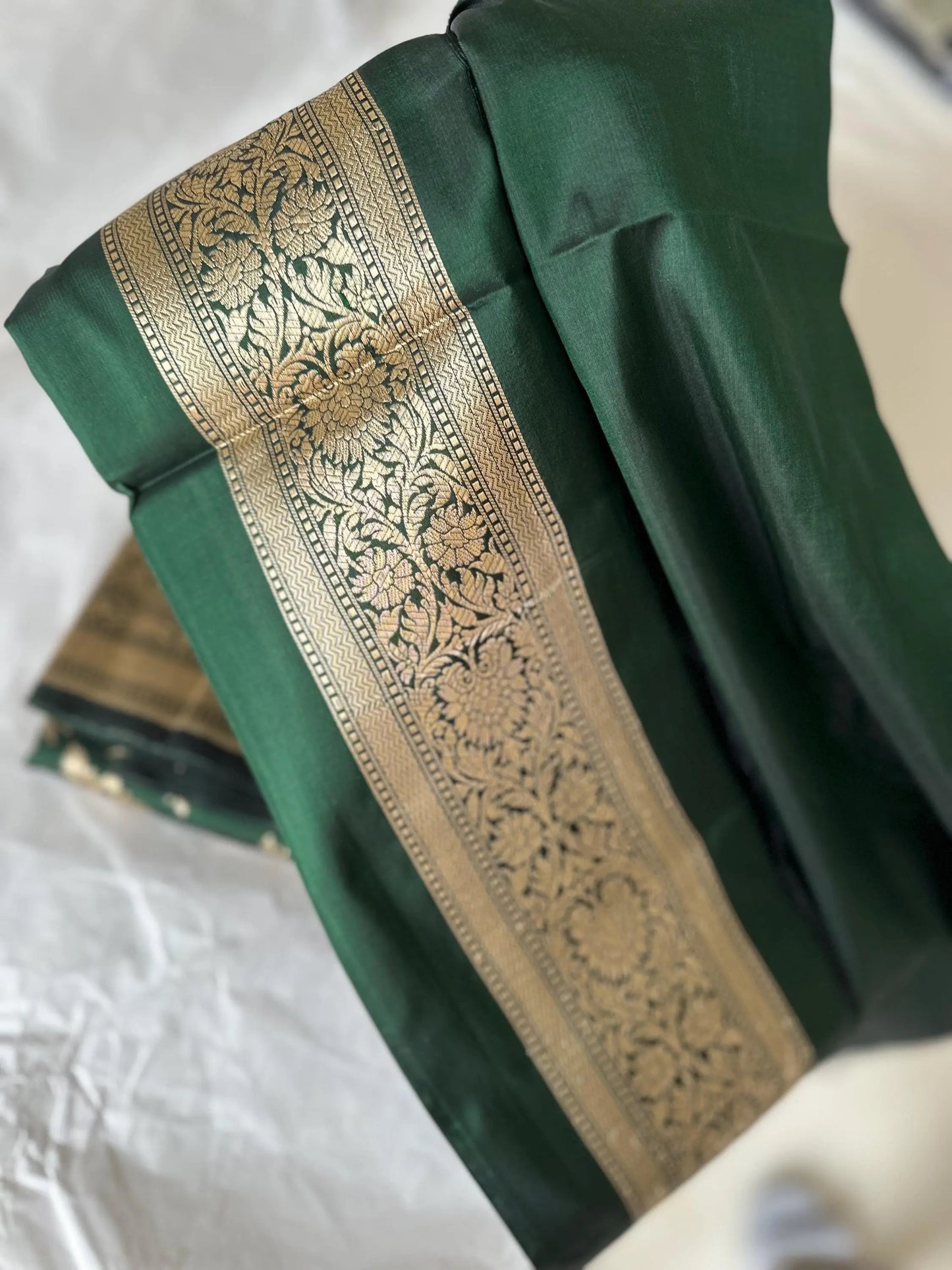 Elegant dark green pure silk Banarasi saree with intricate gold zari work and floral motifs, perfect for weddings and festive occasions Etsy