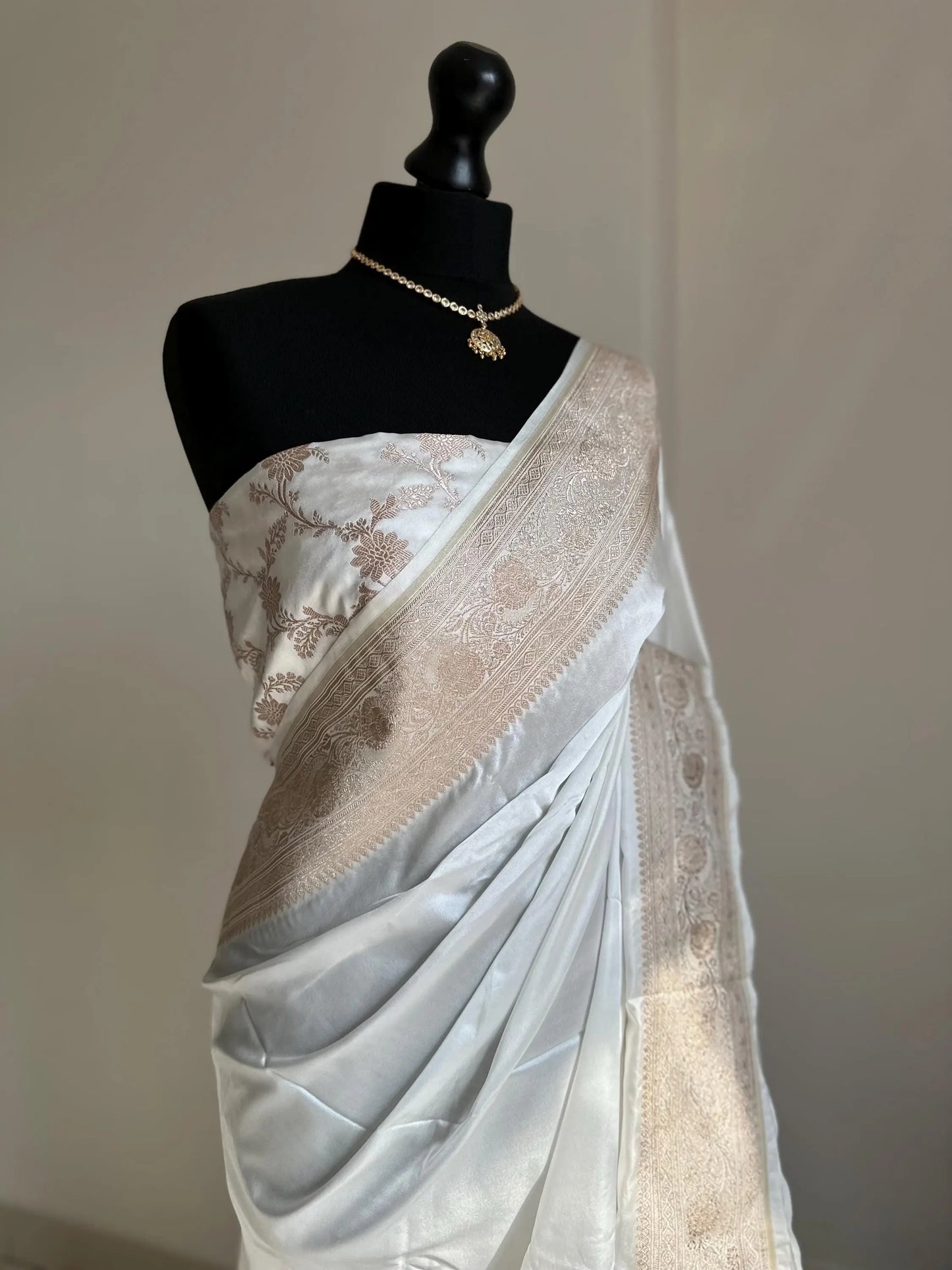Banarasi silk white katan wedding saree with champagne gold zari. Whit traditional silk saree with designer jaal patterned blouse. - LaiLai Sarees