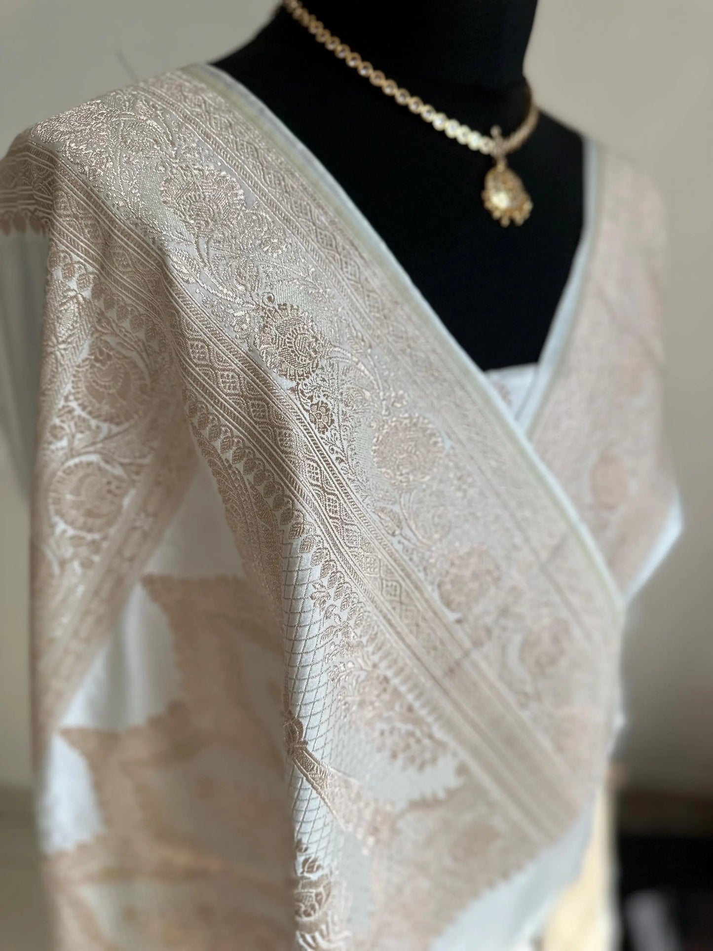 Banarasi silk white katan wedding saree with champagne gold zari. Whit traditional silk saree with designer jaal patterned blouse. - LaiLai Sarees