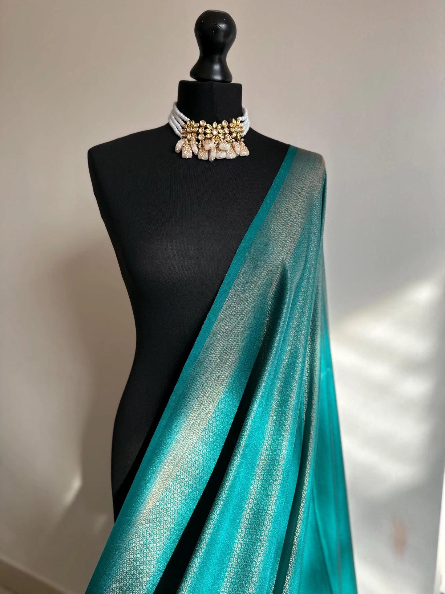 Sea green soft silk saree with a copper border and all over sheen. The perfect saree for parties and all traditional events. - LaiLai Sarees