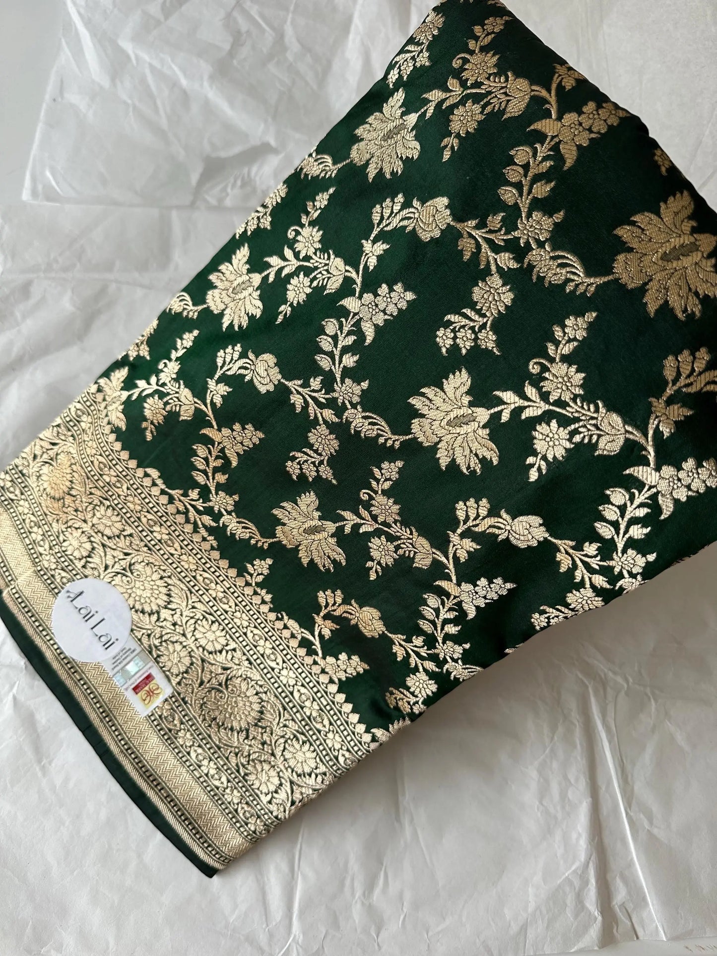 Elegant dark green pure silk Banarasi saree with intricate gold zari work and floral motifs, perfect for weddings and festive occasions Etsy