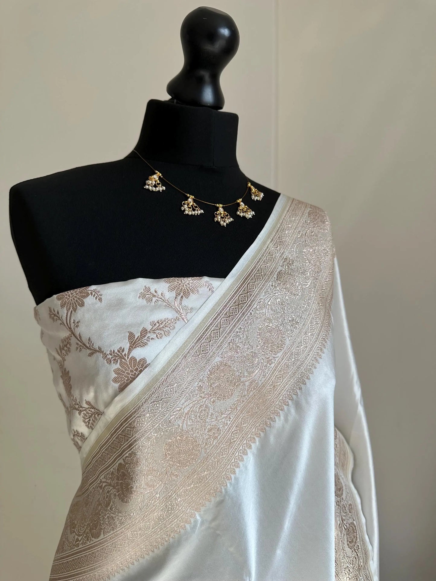 Banarasi silk white katan wedding saree with champagne gold zari. Whit traditional silk saree with designer jaal patterned blouse. - LaiLai Sarees