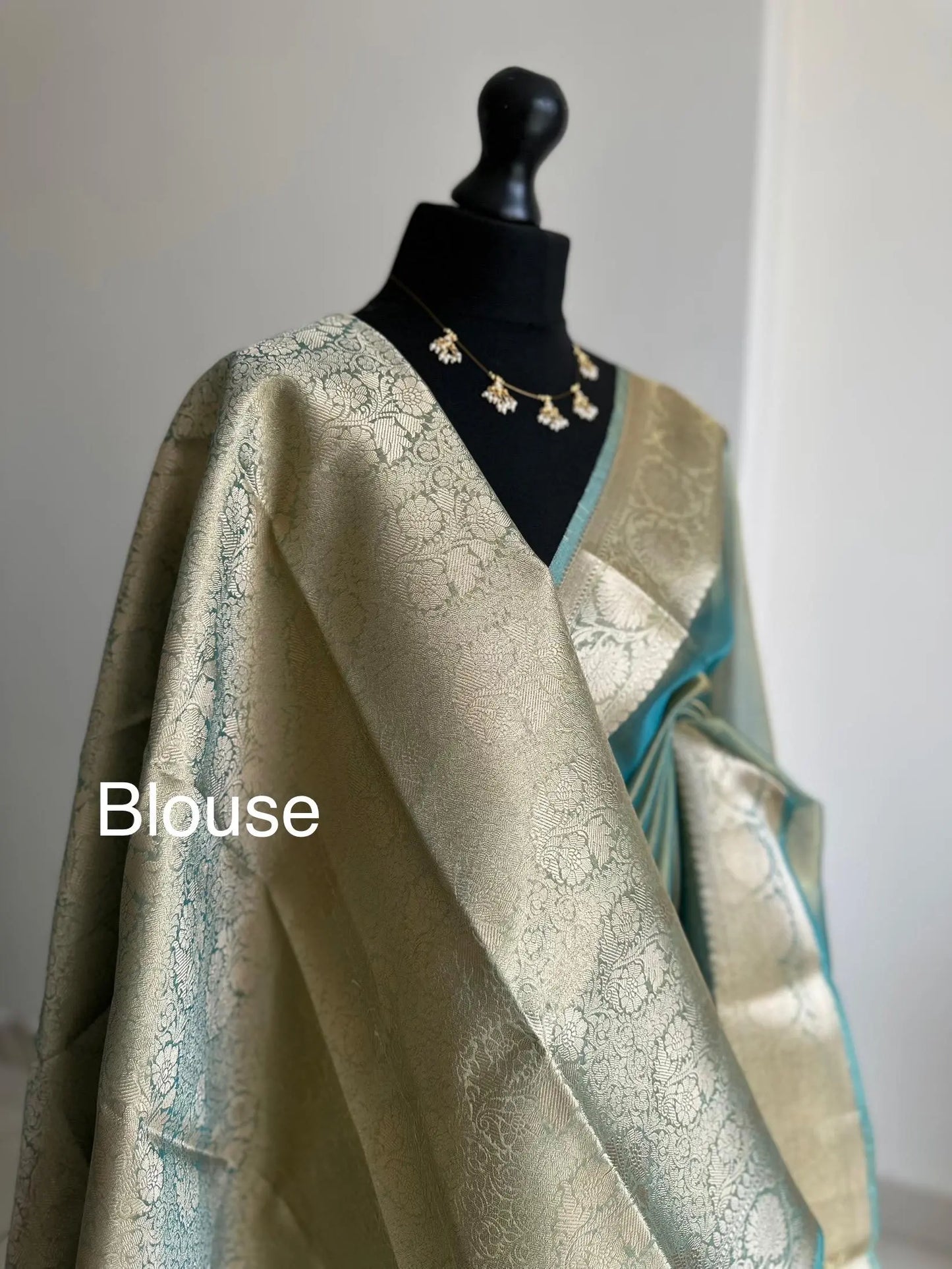 Gold and sea green dual toned plain shimmer soft tissue saree with border and unstitched blouse. Statement tissue saree for wedding events LaiLai Sarees