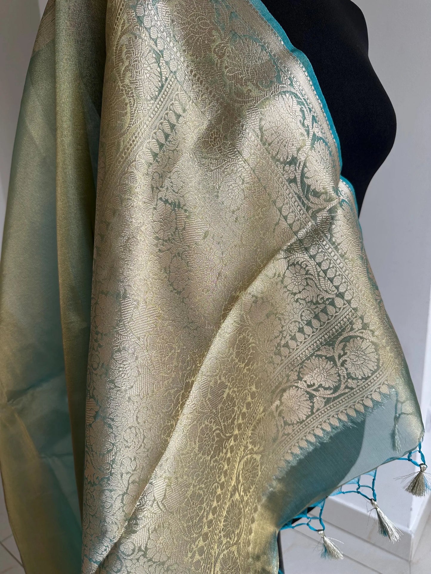 Gold and sea green dual toned plain shimmer soft tissue saree with border and unstitched blouse. Statement tissue saree for wedding events LaiLai Sarees