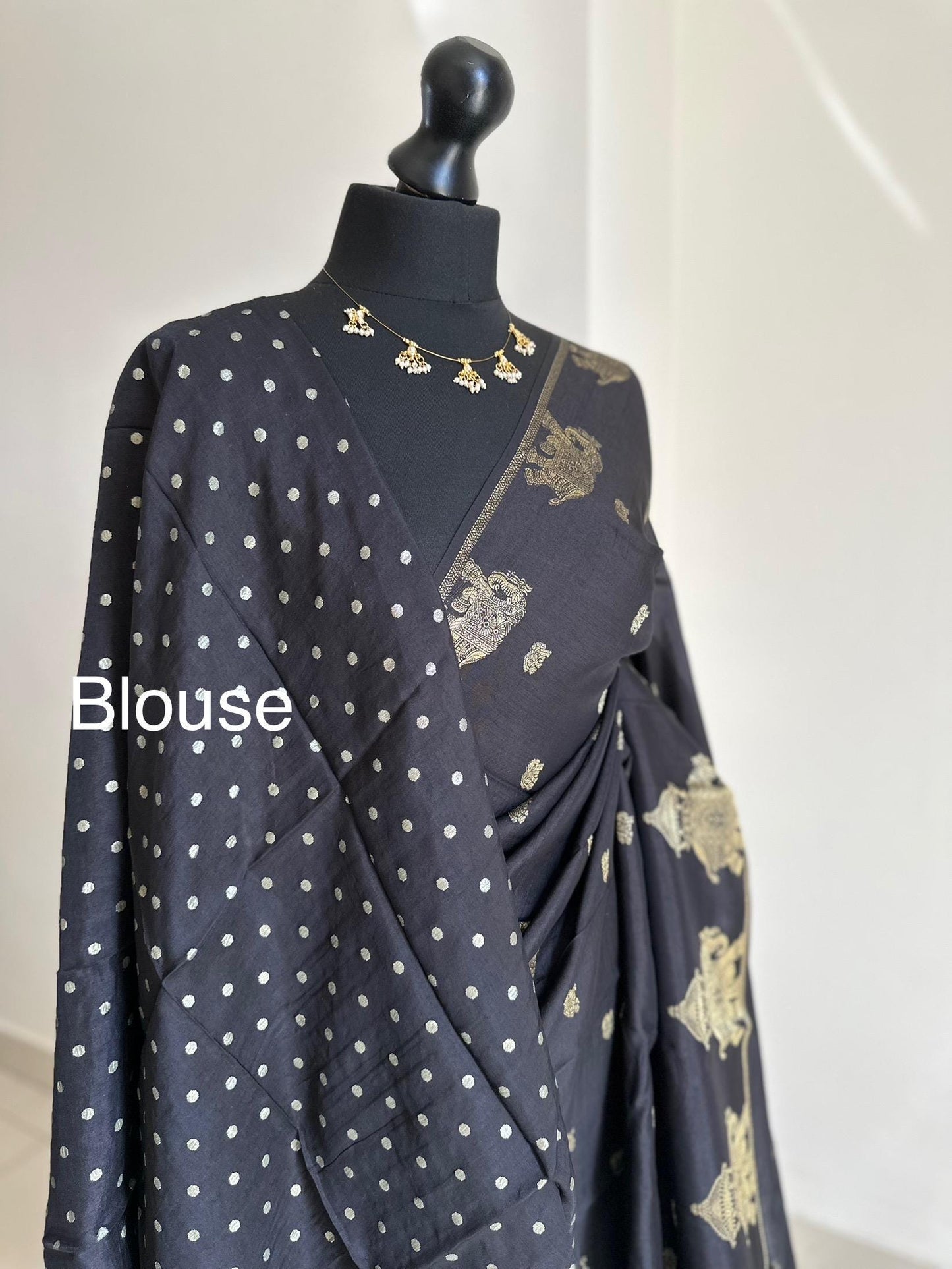 Black semi silk saree with subtle gold zari elephant border and polka dot blouse. Traditional Indian saree elegant festive wear