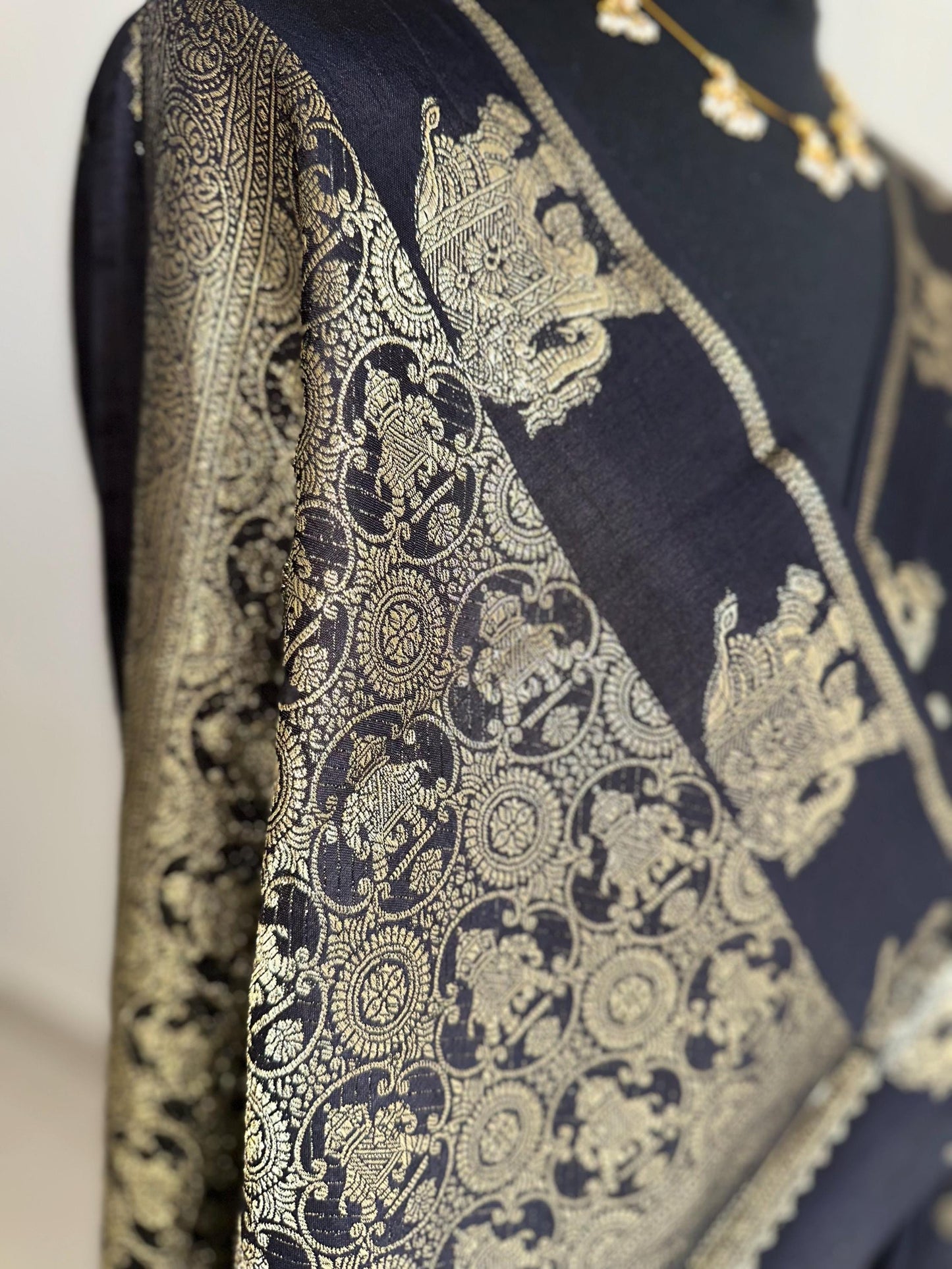 Black semi silk saree with subtle gold zari elephant border and polka dot blouse. Traditional Indian saree elegant festive wear
