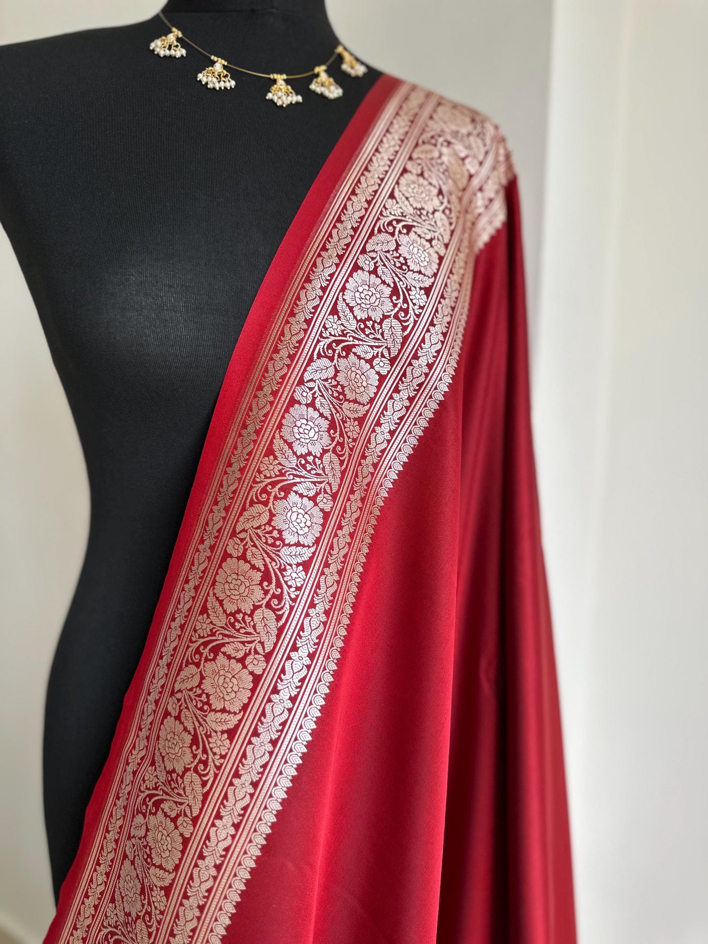 Banarasi silk crimson red katan wedding saree with gold zari. Red traditional silk saree with designer patterned blouse.