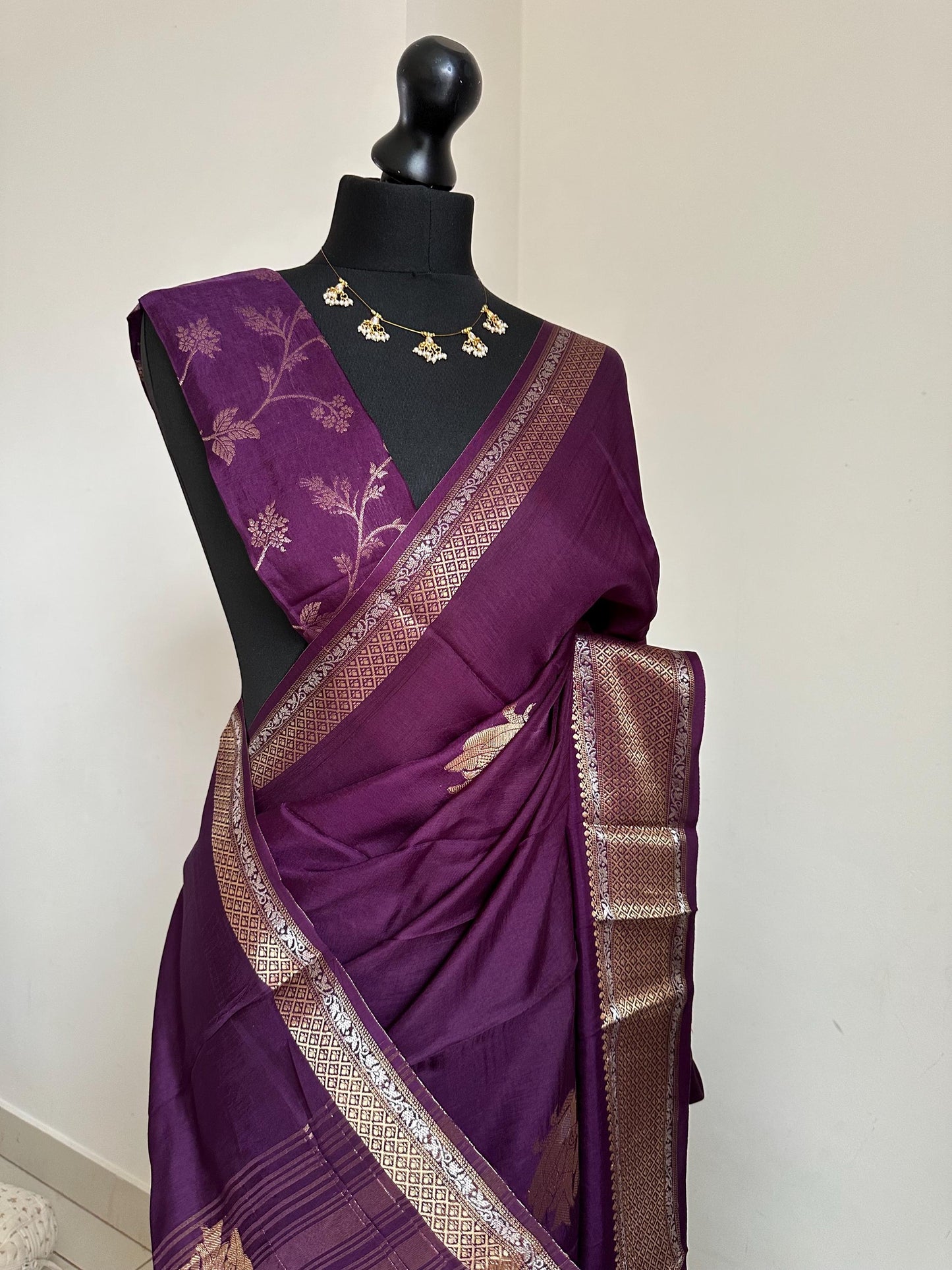 Purple semi silk saree with subtle gold and silver zari border and peacock motifs. Floral jaal blouse. Partwear traditional saree