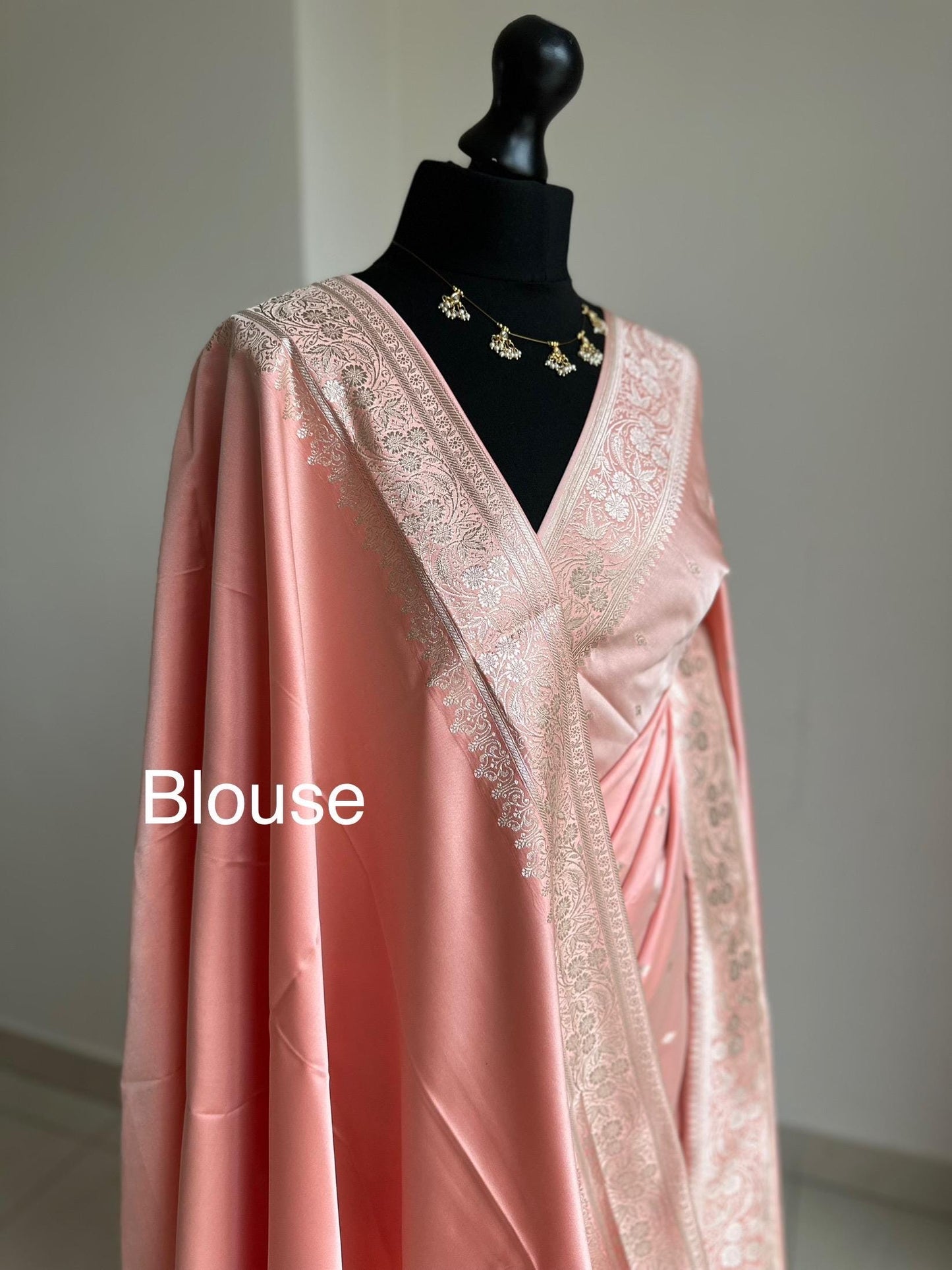 Banarasi silk pastel peach wedding saree with gold Zari. Champagne gold zari on traditional saree with plain contrast unstitched blouse