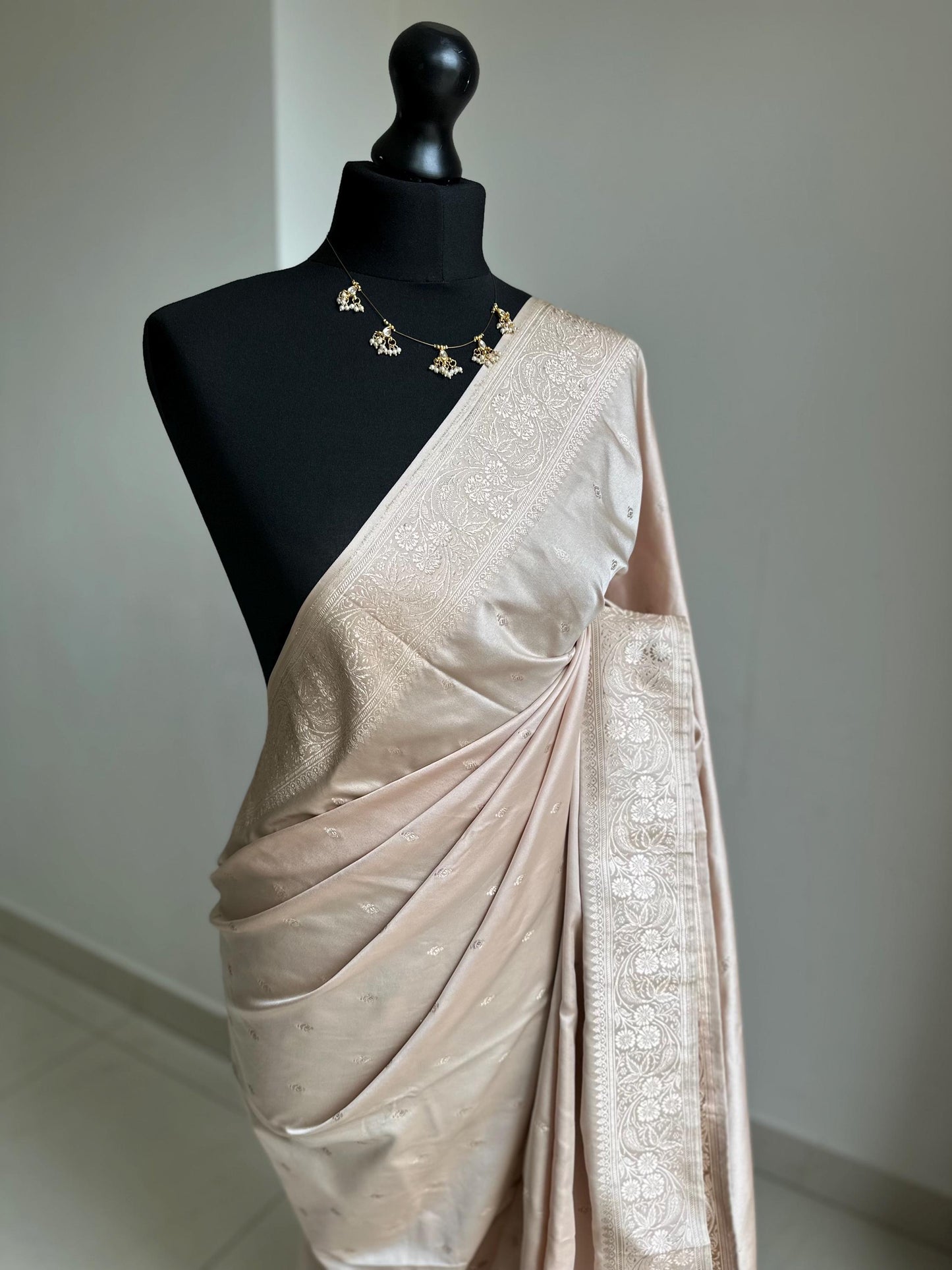 Banarasi silk beige blush wedding saree with champagne gold Zari. Champagne gold zari on traditional saree with plain contrast blouse