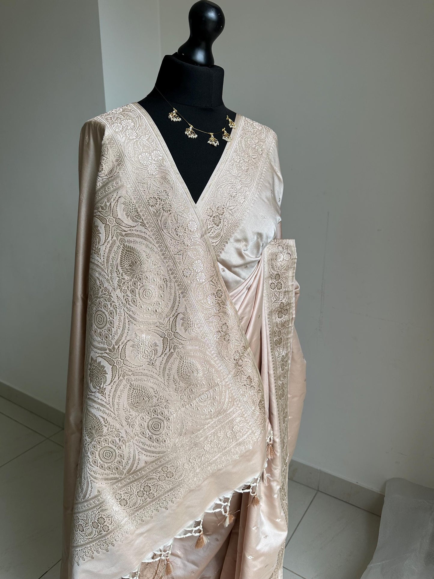 Banarasi silk beige blush wedding saree with champagne gold Zari. Champagne gold zari on traditional saree with plain contrast blouse