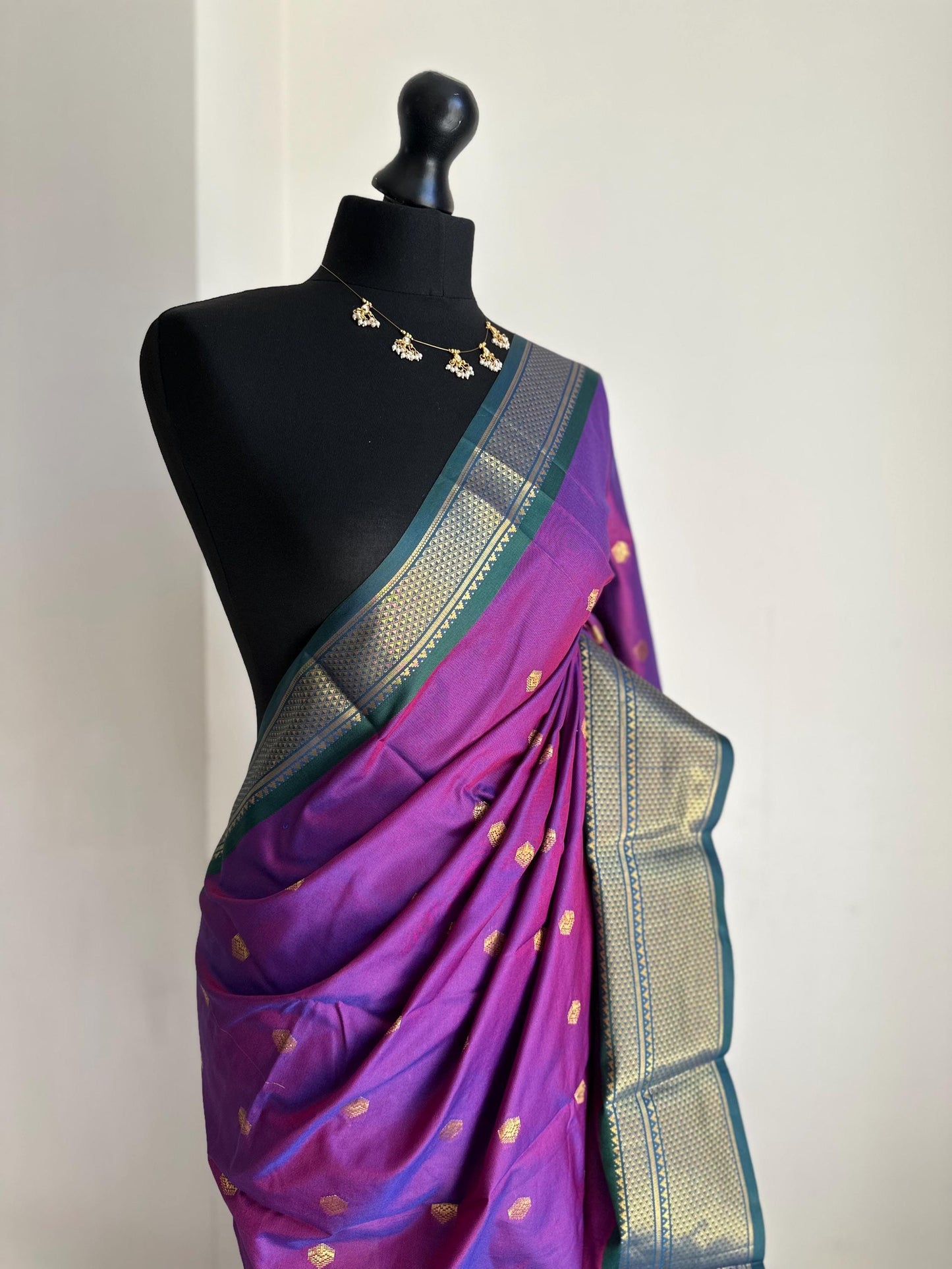 Purple and green semi silk saree with gold zari border and buti. Traditional designer saree beautiful colour and design.