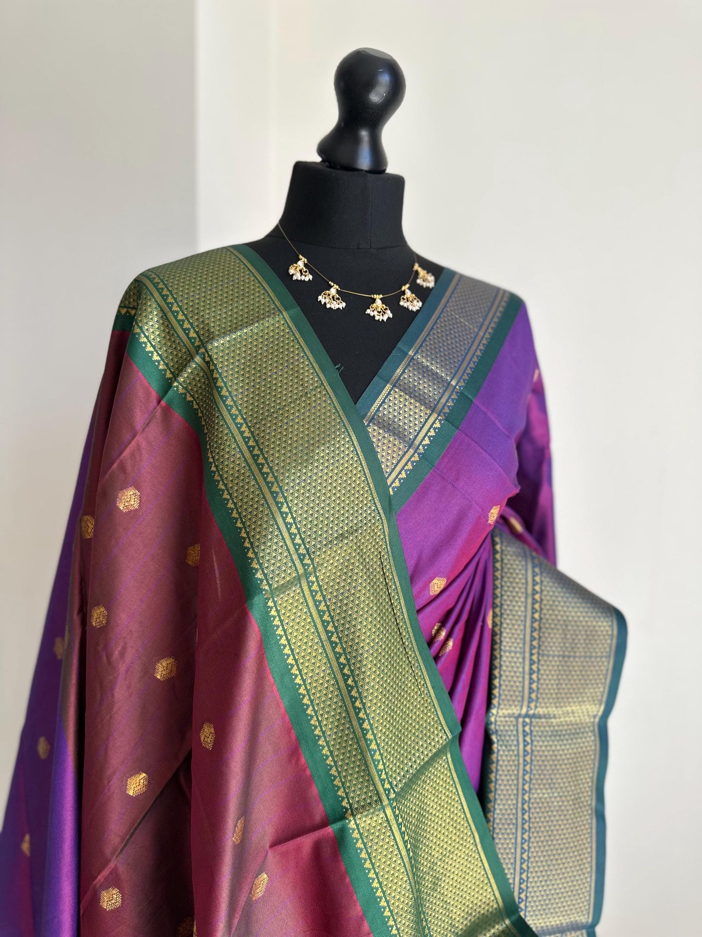 Purple and green semi silk saree with gold zari border and buti. Traditional designer saree beautiful colour and design.