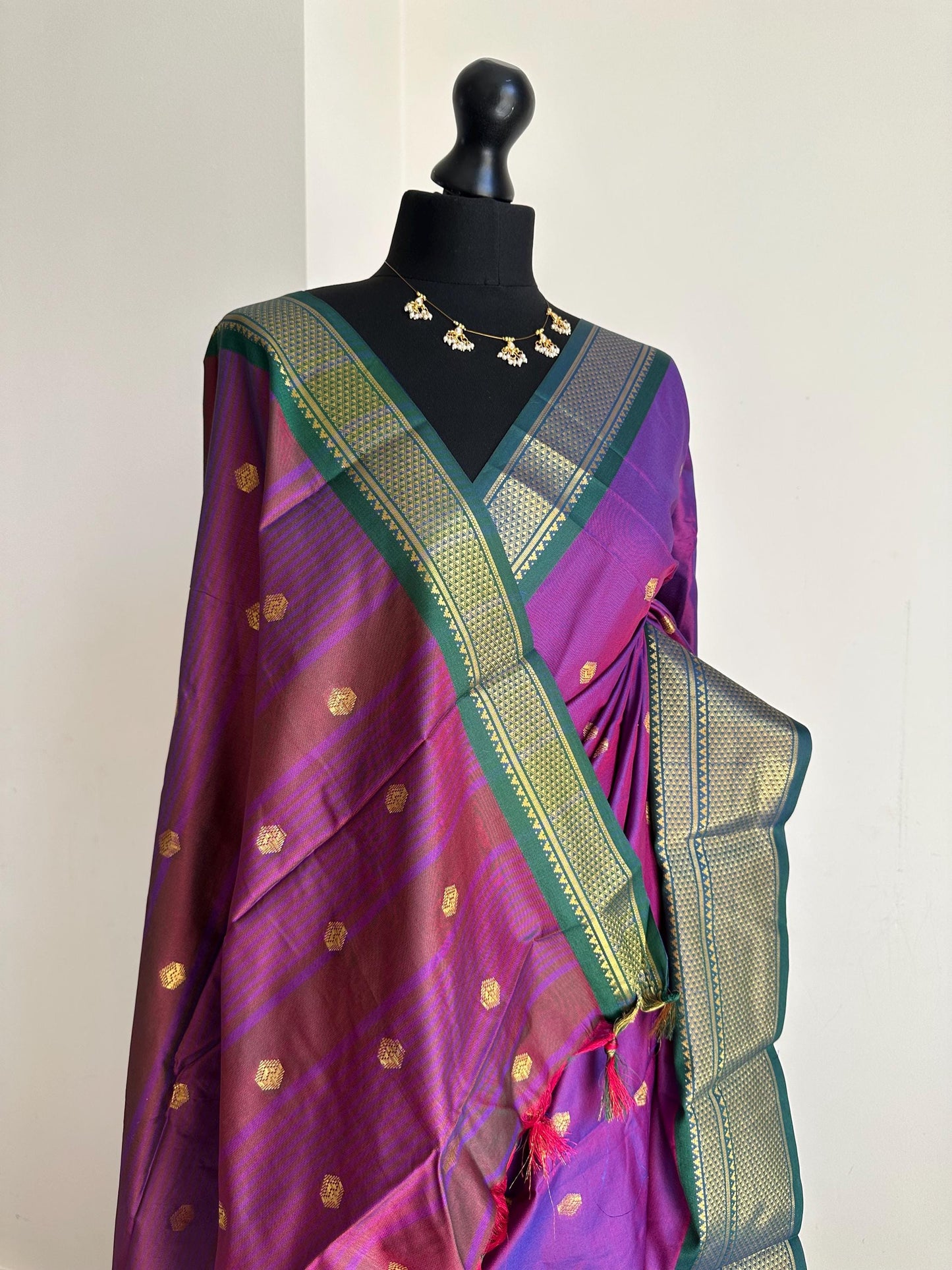 Purple and green semi silk saree with gold zari border and buti. Traditional designer saree beautiful colour and design.