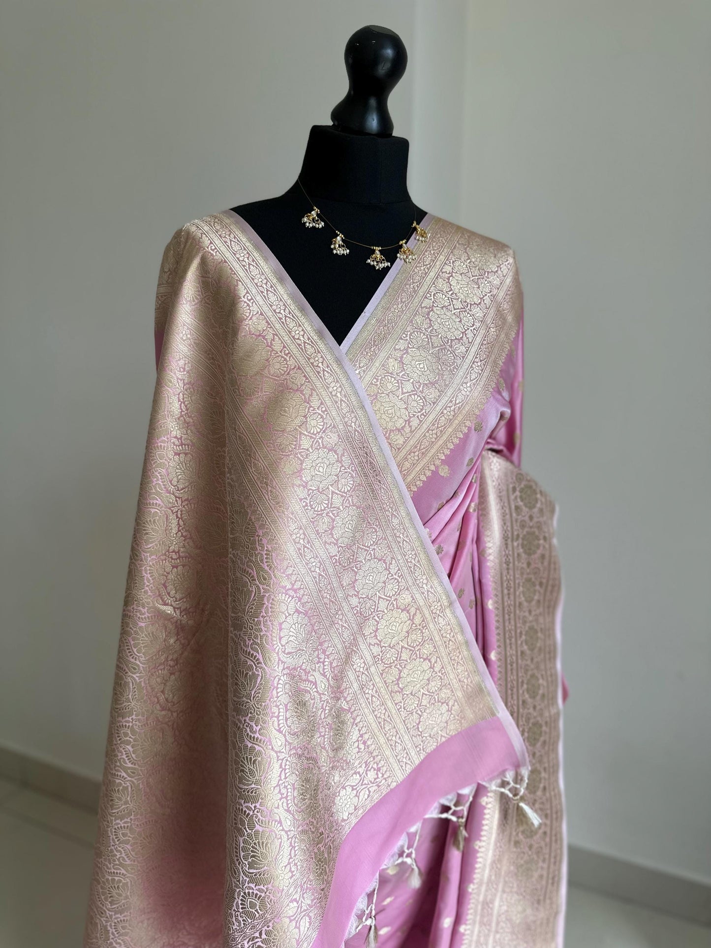Banarasi silk soft pink wedding saree with gold zari. Gold and baby pink silk traditional saree with plain contrast blouse with border