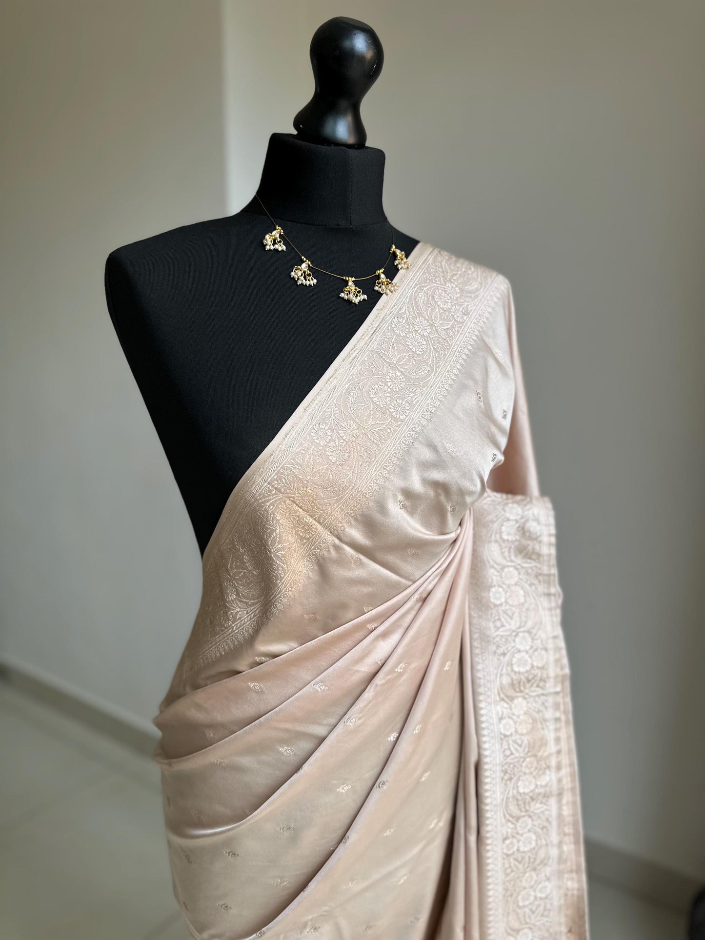 Banarasi silk beige blush wedding saree with champagne gold Zari. Champagne gold zari on traditional saree with plain contrast blouse