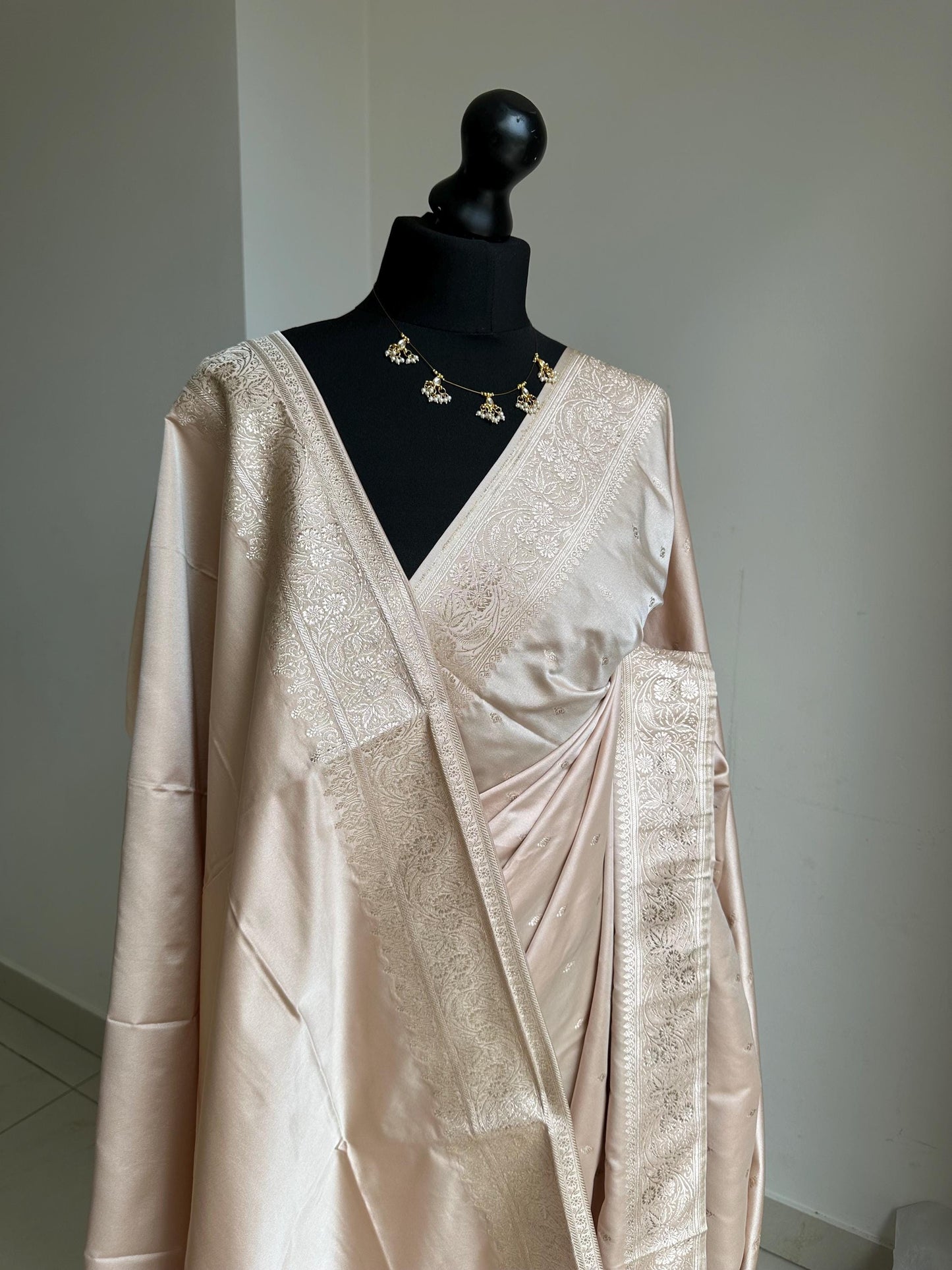 Banarasi silk beige blush wedding saree with champagne gold Zari. Champagne gold zari on traditional saree with plain contrast blouse