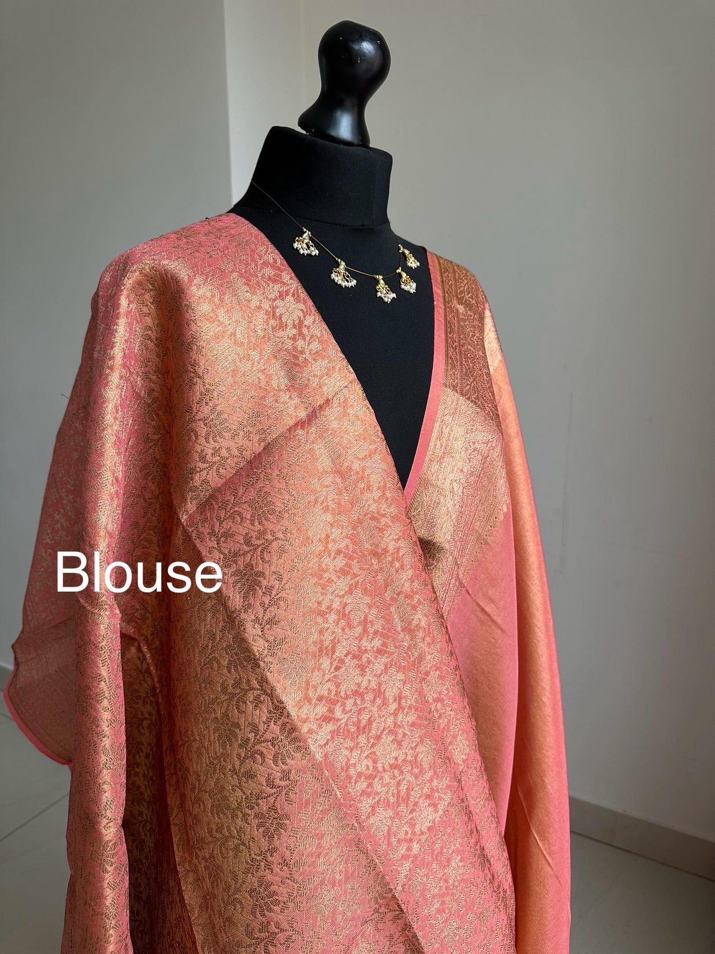 Statement handmade peach coral soft tissue saree with unstitched blouse. Gold and peach wedding saree. Unique saree look for events
