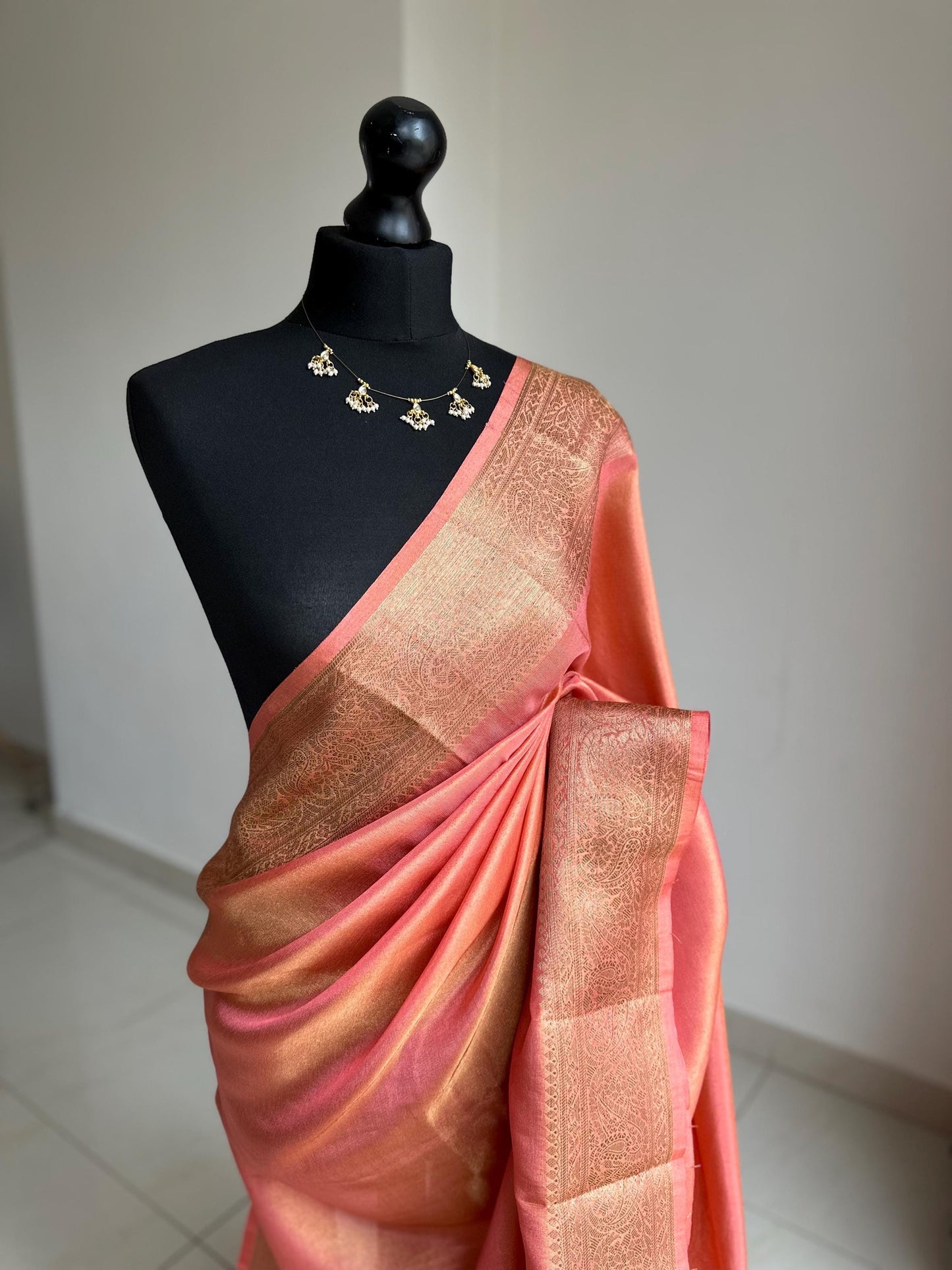 Statement handmade peach coral soft tissue saree with unstitched blouse. Gold and peach wedding saree. Unique saree look for events