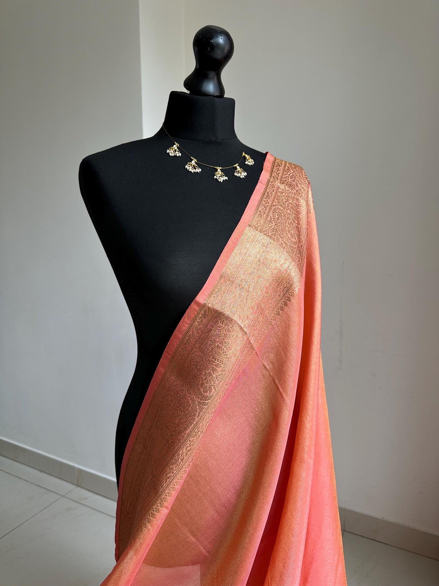 Statement handmade peach coral soft tissue saree with unstitched blouse. Gold and peach wedding saree. Unique saree look for events
