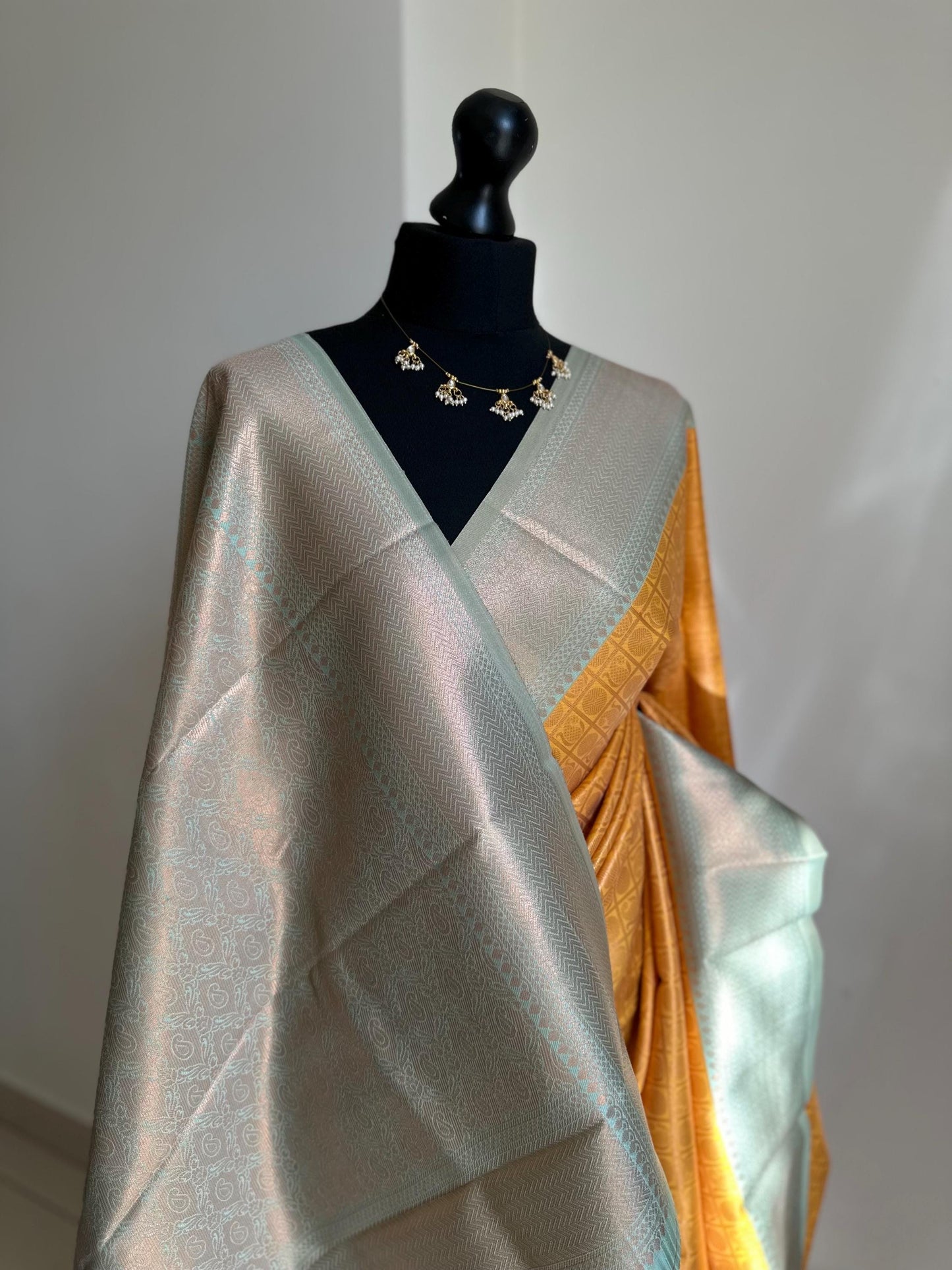 Pastel blue and mustard Semi Silk Saree: Gold Zari Border, Unstitched Blouse