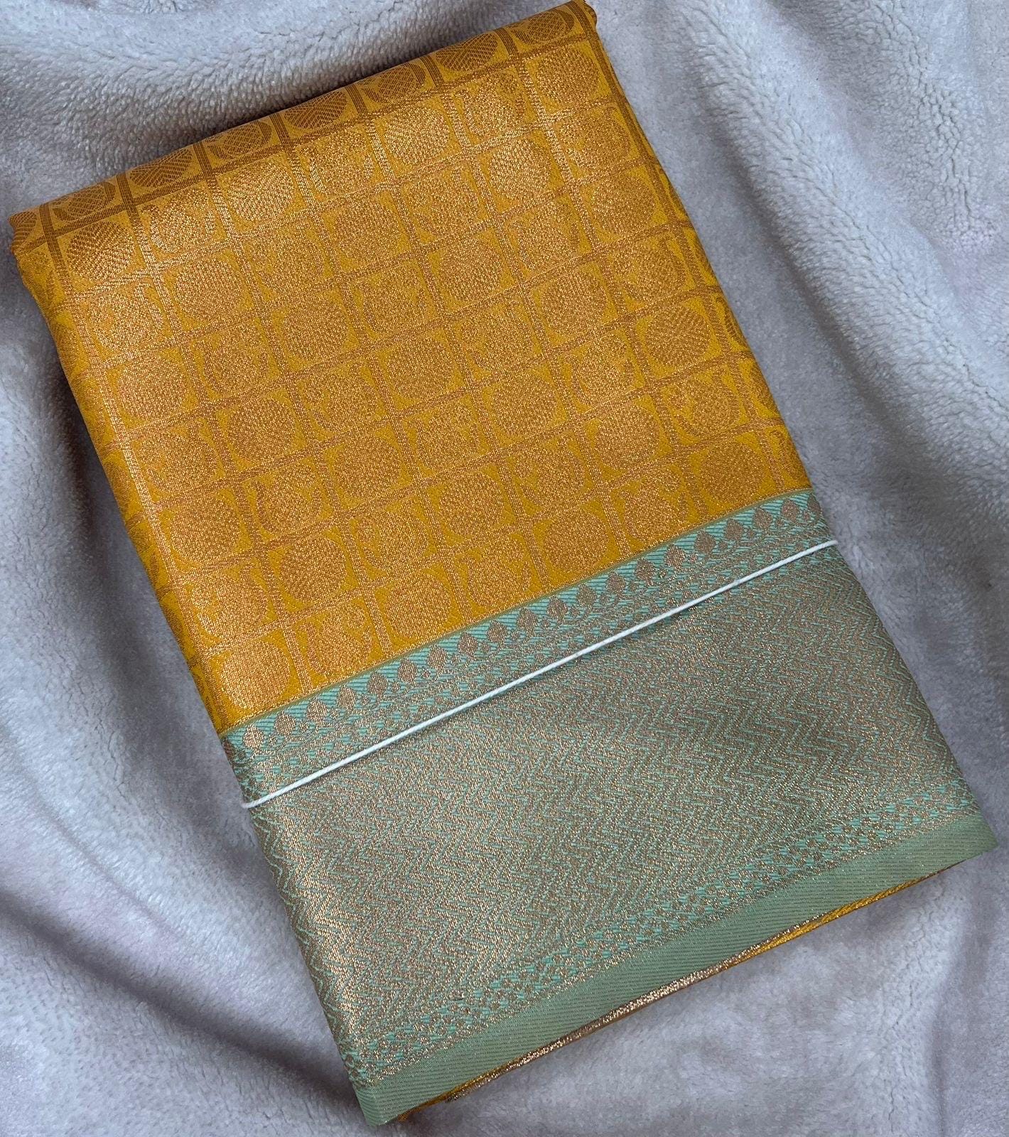 Pastel blue and mustard Semi Silk Saree: Gold Zari Border, Unstitched Blouse