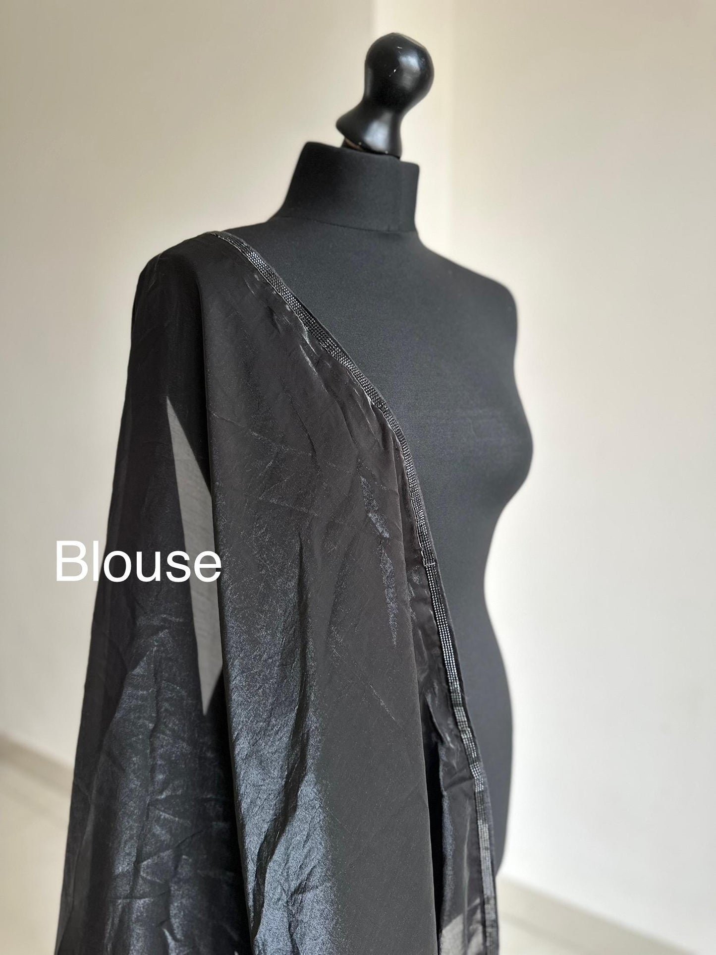 Ready-pleated black and purple shaded saree with cutdana stonework border, comes with belt. Prestitched saree for parties