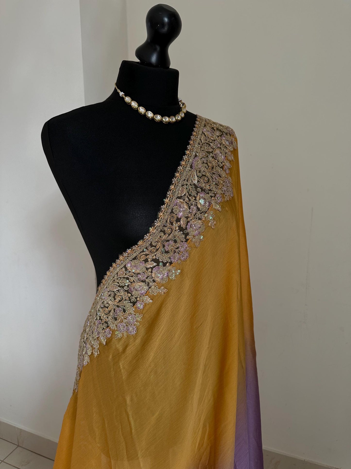 Shaded chiffon party wear Saree with stunning sequin stone embellished border. Lilac purple and mango orange soft lustre saree for occasion