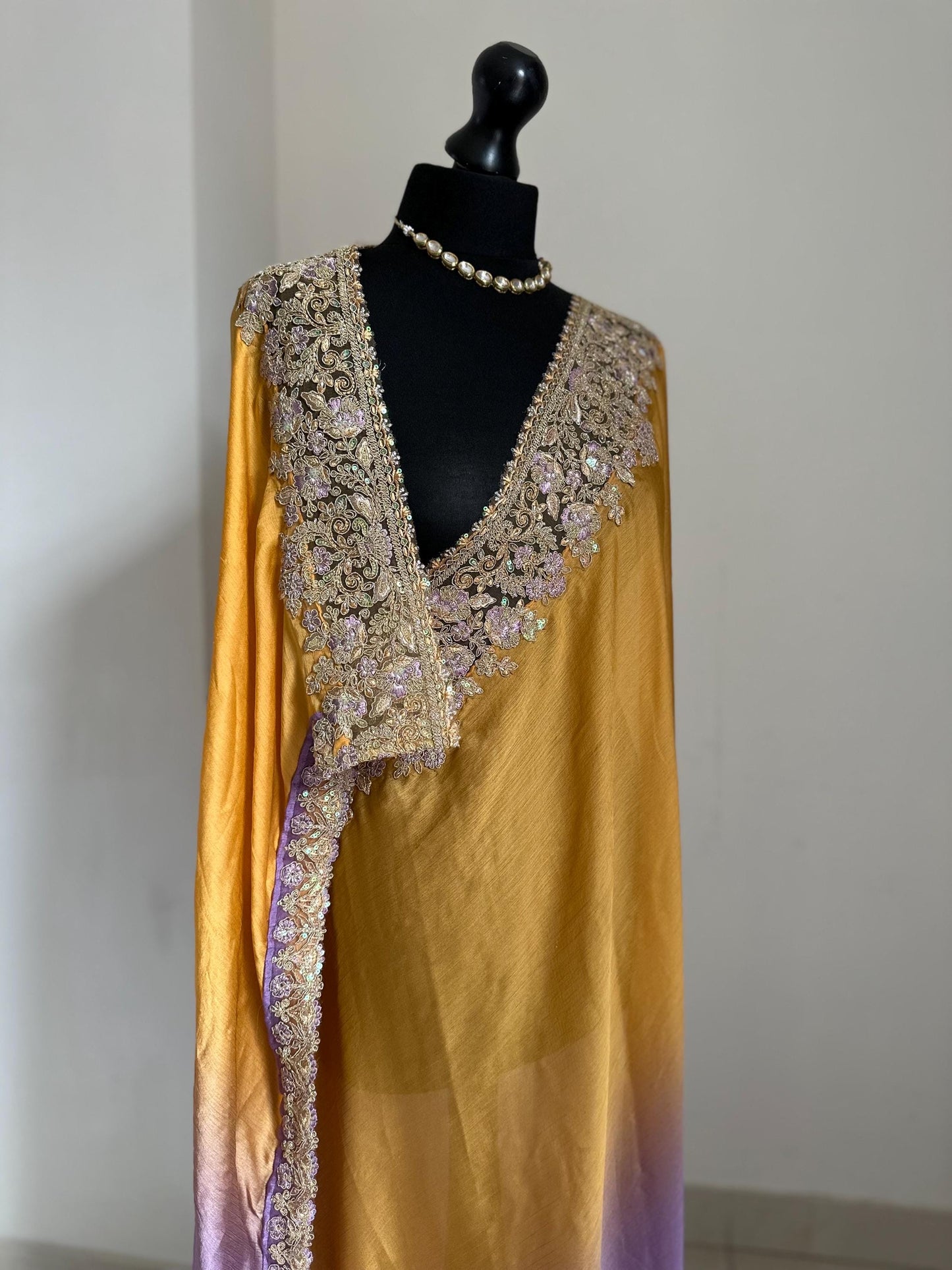Shaded chiffon party wear Saree with stunning sequin stone embellished border. Lilac purple and mango orange soft lustre saree for occasion