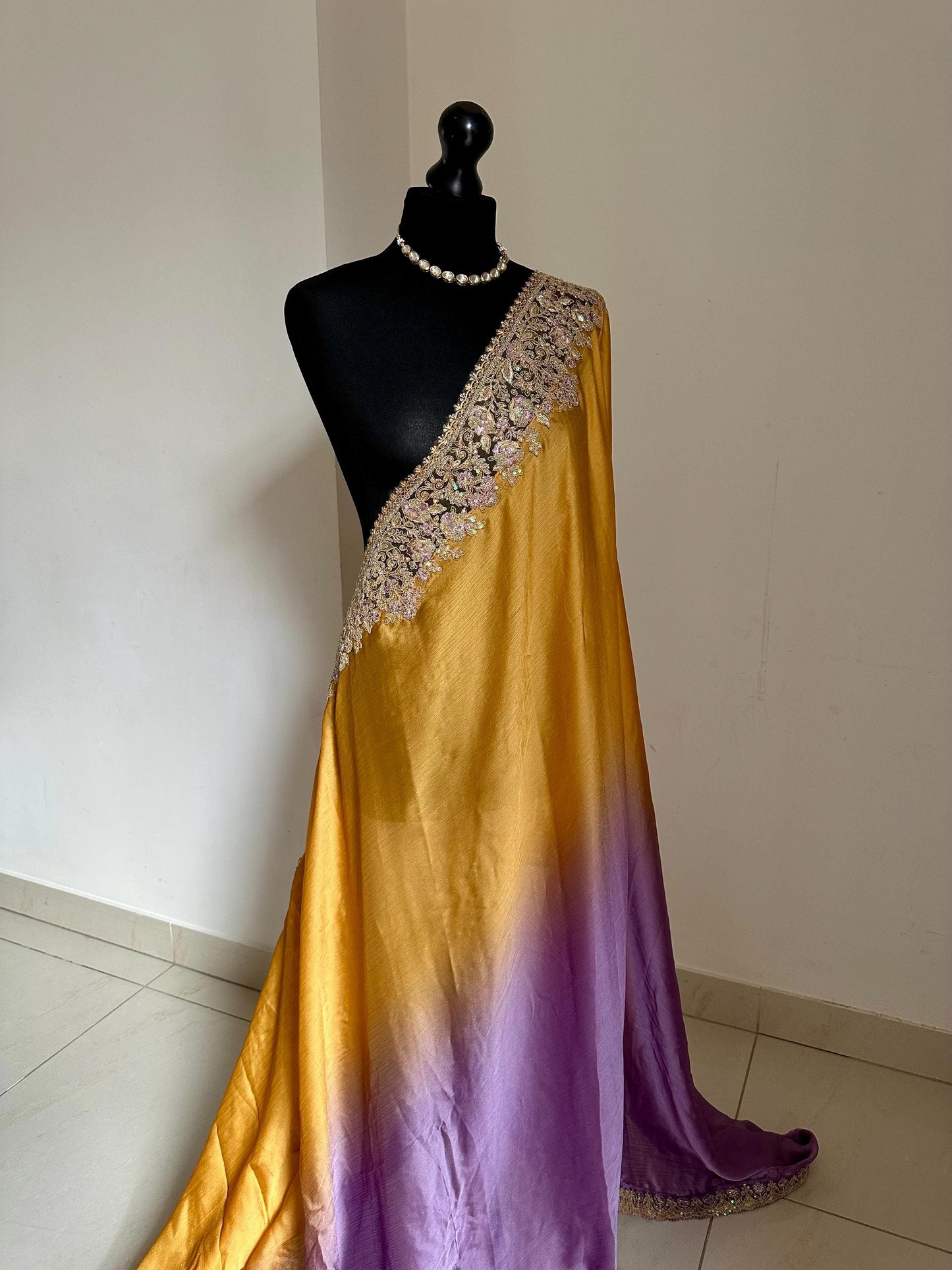 Shaded chiffon party wear Saree with stunning sequin stone embellished border. Lilac purple and mango orange soft lustre saree for occasion