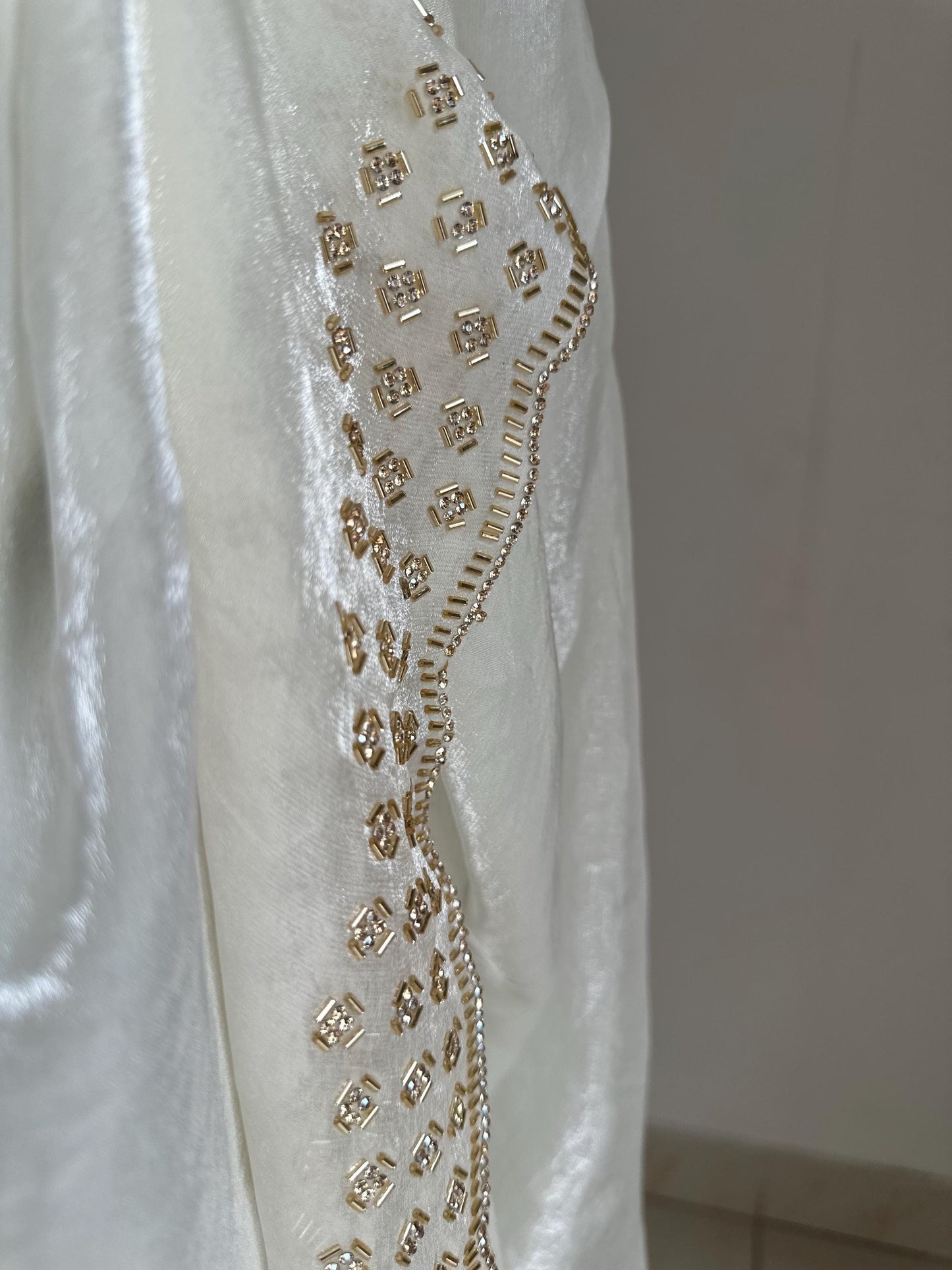 Off white party bridal saree with embellished scalloped border. Soft chiffon versatile saree thats perfect for parties and evening events.