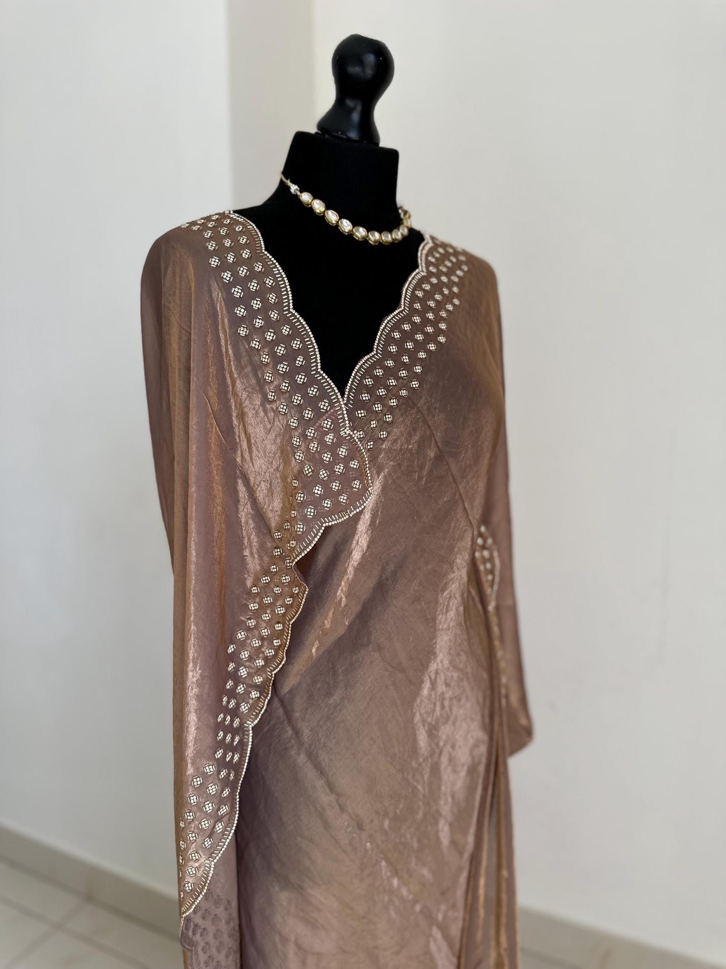 Copper brown party saree with embellished scalloped border. Soft chiffon versatile saree thats perfect for parties and evening events.
