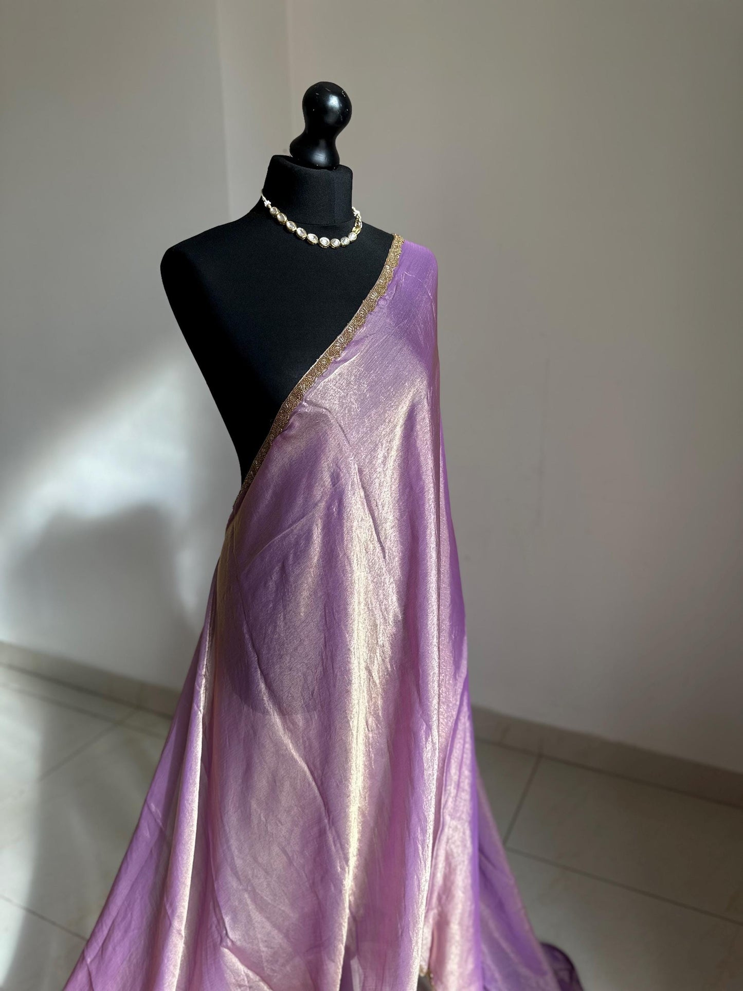 Lilac chiffon saree with cutdana border. Crafted from soft shimmer chiffon this saree is perfect for parties and evening occasions