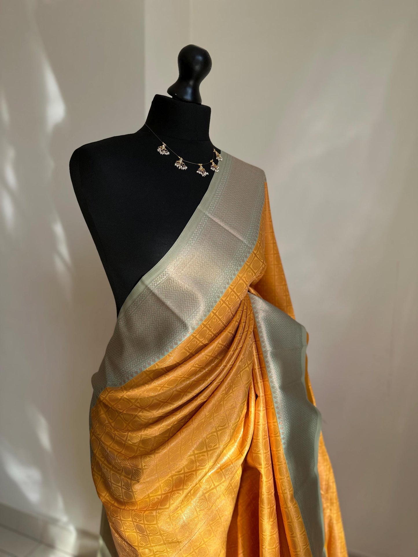 Pastel blue and mustard Semi Silk Saree: Gold Zari Border, Unstitched Blouse