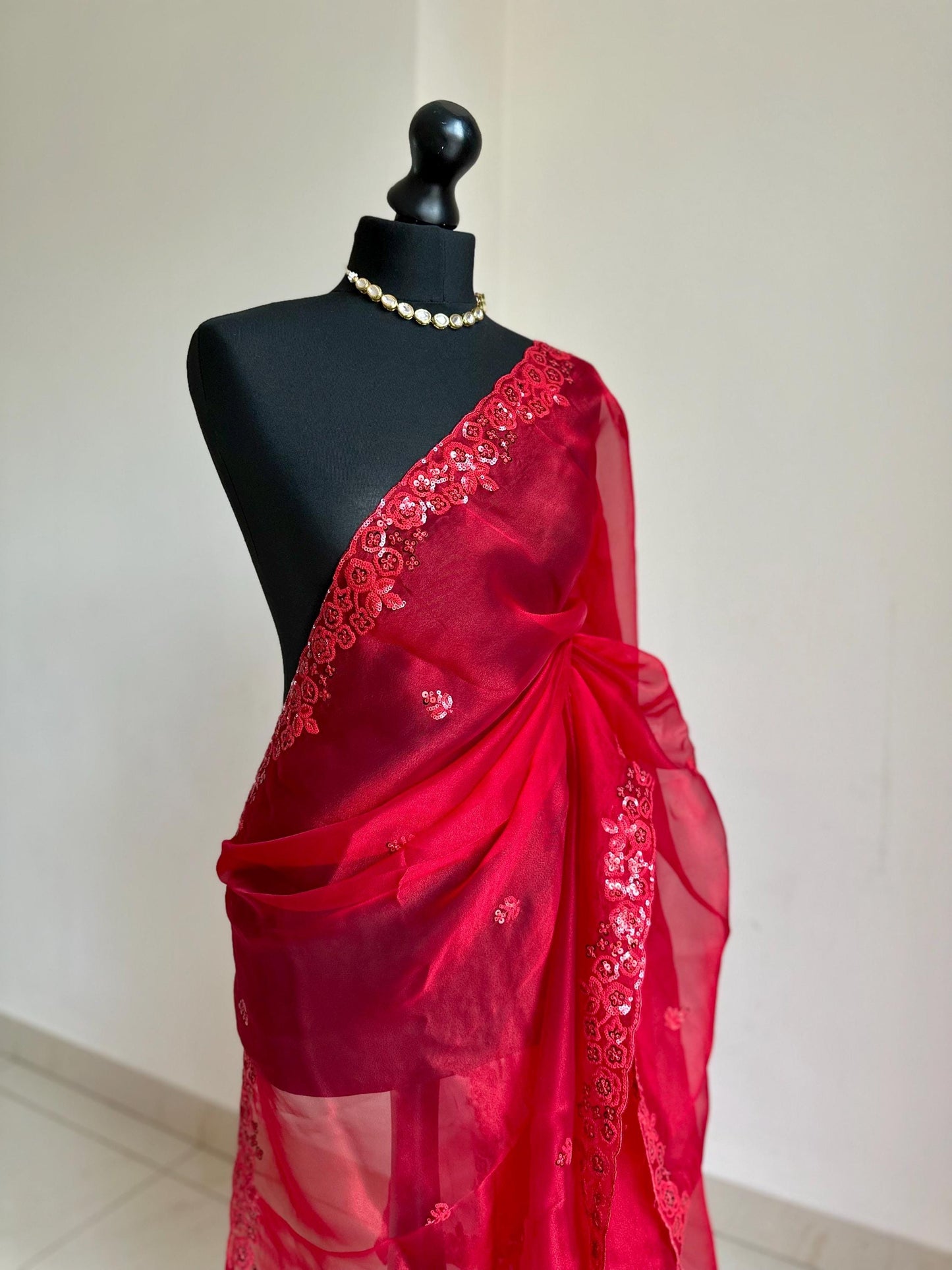 Red organza saree with red sequin detailing. Elegant red on red saree for occasions.